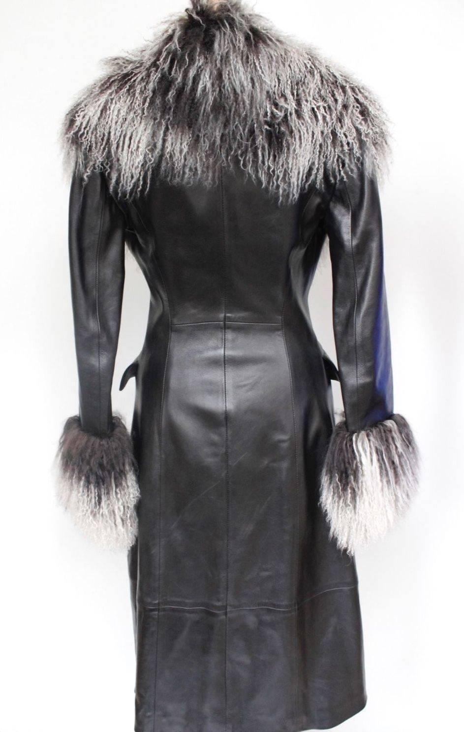 Jitrois Black Leather Mongolian Fur Trim Coat F 38 uk 10 
Glamorous coat from Jitrois featuring oversized fur collar and cuffs 
Double breasted fastening with pearl logo buttons 
Pockets to the hips, fully lined 
Length 43 length, sleeve 23