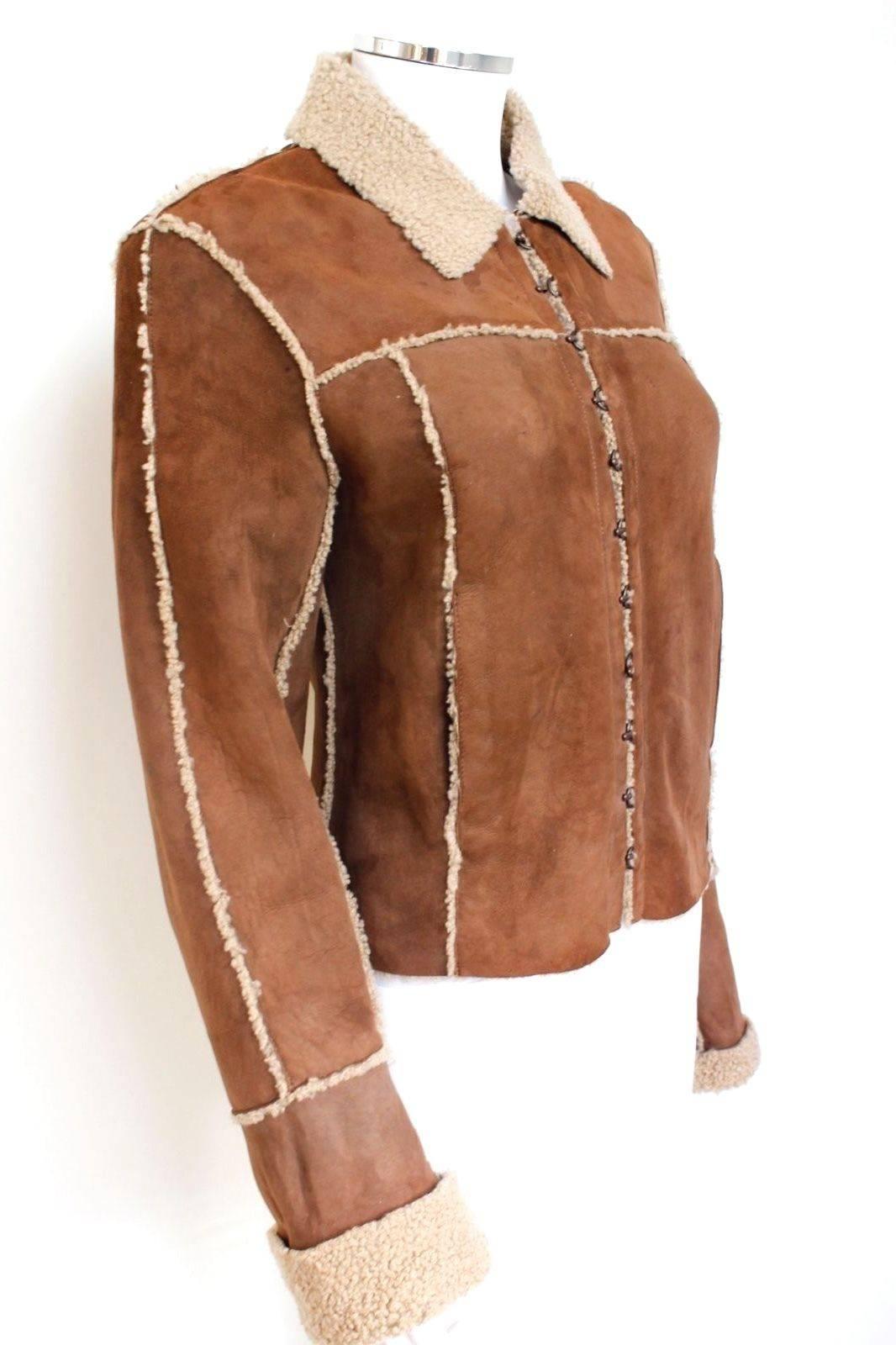 Balmain Brown Shearling Sheepskin Leather Jacket 38 uk 8
Amazing Balmain chestnut brown jacket with shearling contrasting seams and lining.
Front pockets with hook closure 
Length 21 inches, chest 18 inches across, waist 17 inches across laid