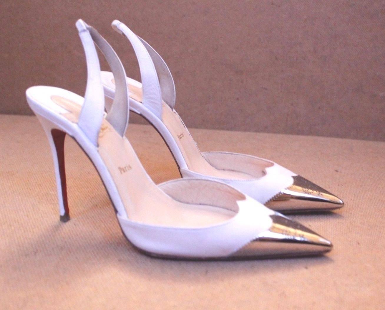 CHRISTIAN LOUBOUTIN White Silver Calamijane Metal Cap Toe 36.5
Beautiful white heels from Christian Louboutin featuring a silver capped toe 
Slim heel and sling back style 
Used a few times some signs of wear to the heel base and tip 
The tip is