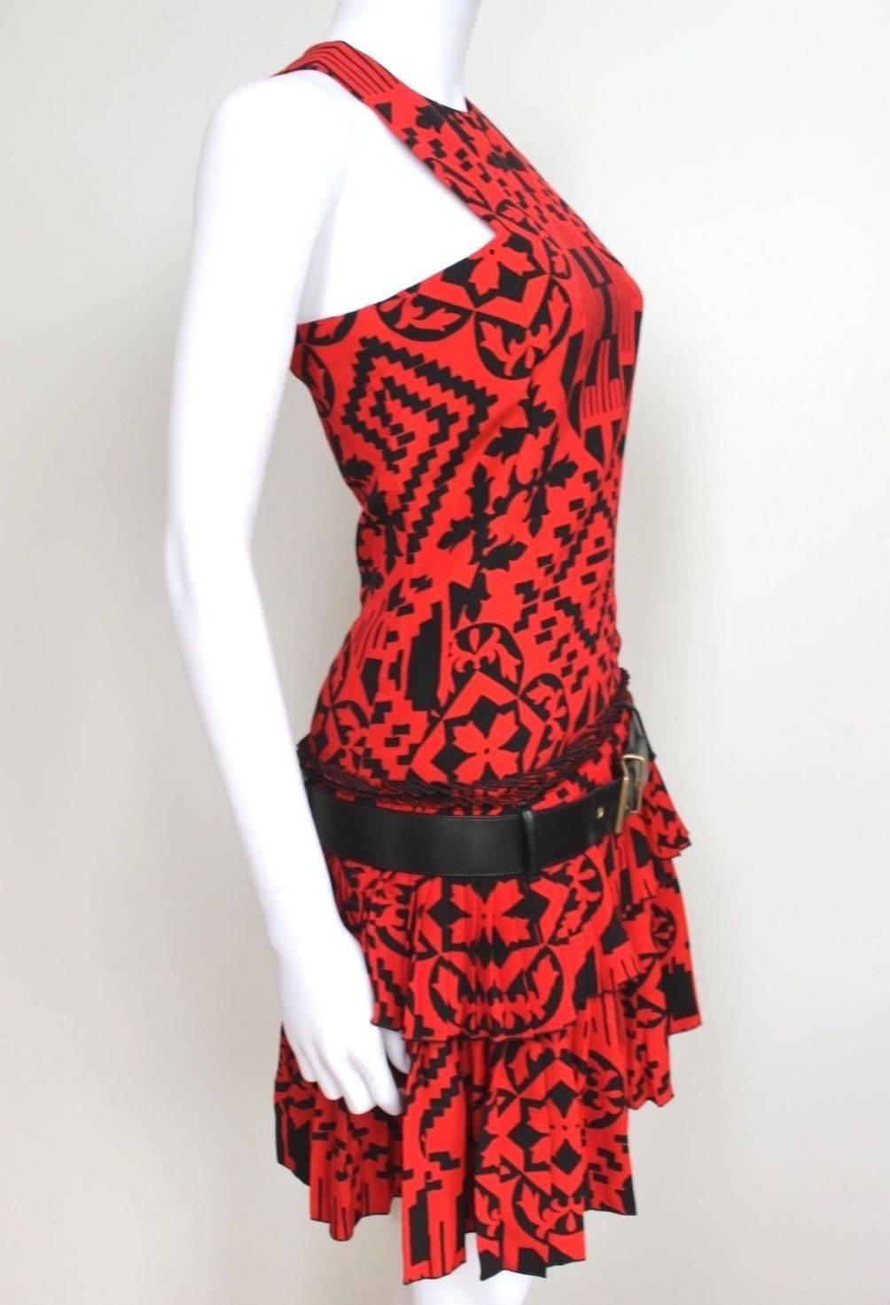 New Alexander McQueen Resort 2014 Red Print Pleated dress 38 uk 6-8
Amazing dress From Alexander McQueen featuring bold black and red print, dropped waist black belt with pleated layered skirt 
Crew neck and fitted bodice, loose fitted skirt
60%