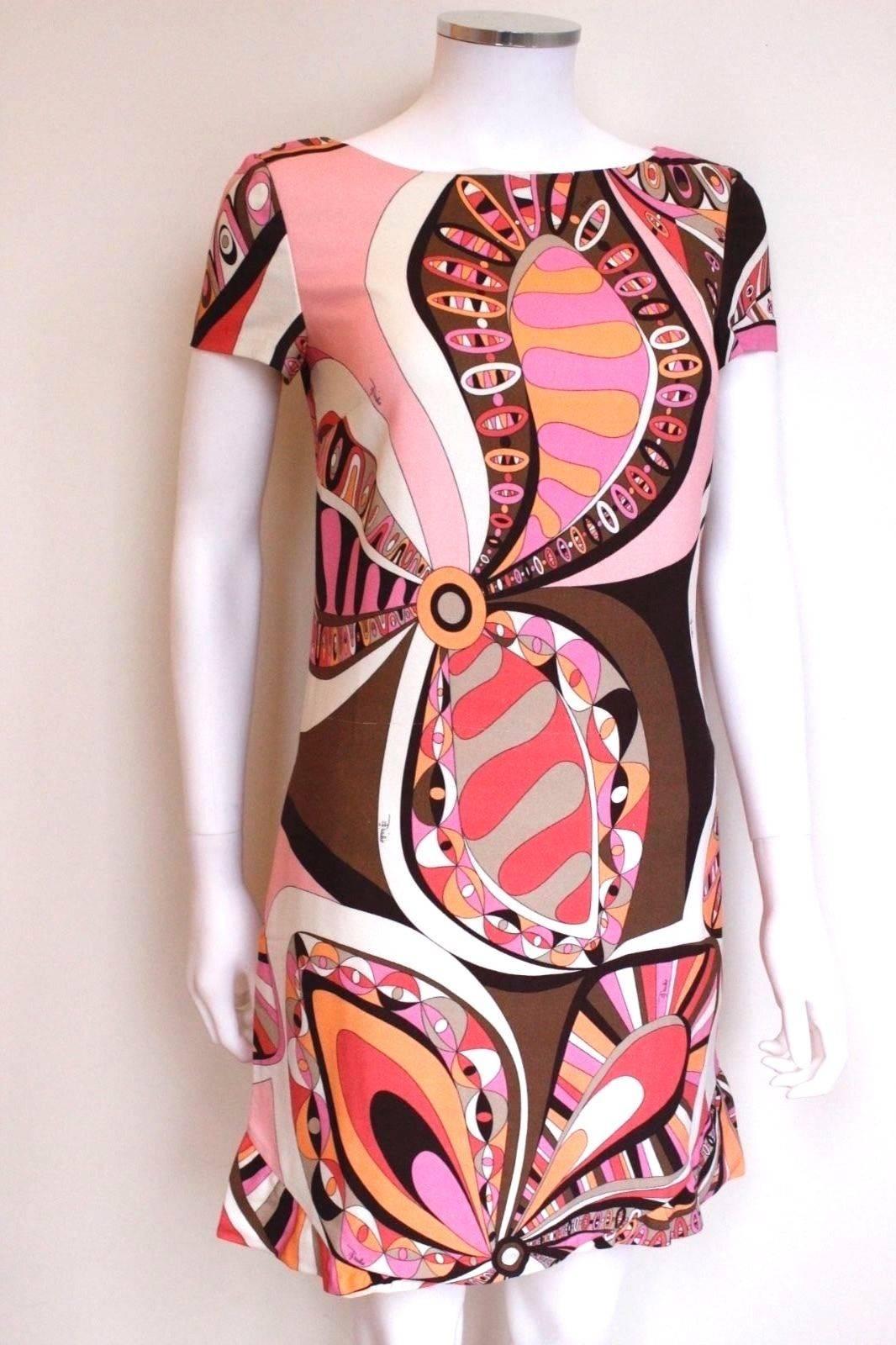 Emilio Pucci Pink Print Resort 2015 Dress 40 uk 8 
Bold swirl floral print from Pucci 2015 collection 
Shift style with short sleeves 
Fully lined in silk, with concealed pockets to the side 
97% Viscose 3% Elastane
New, only a thread pulled to the