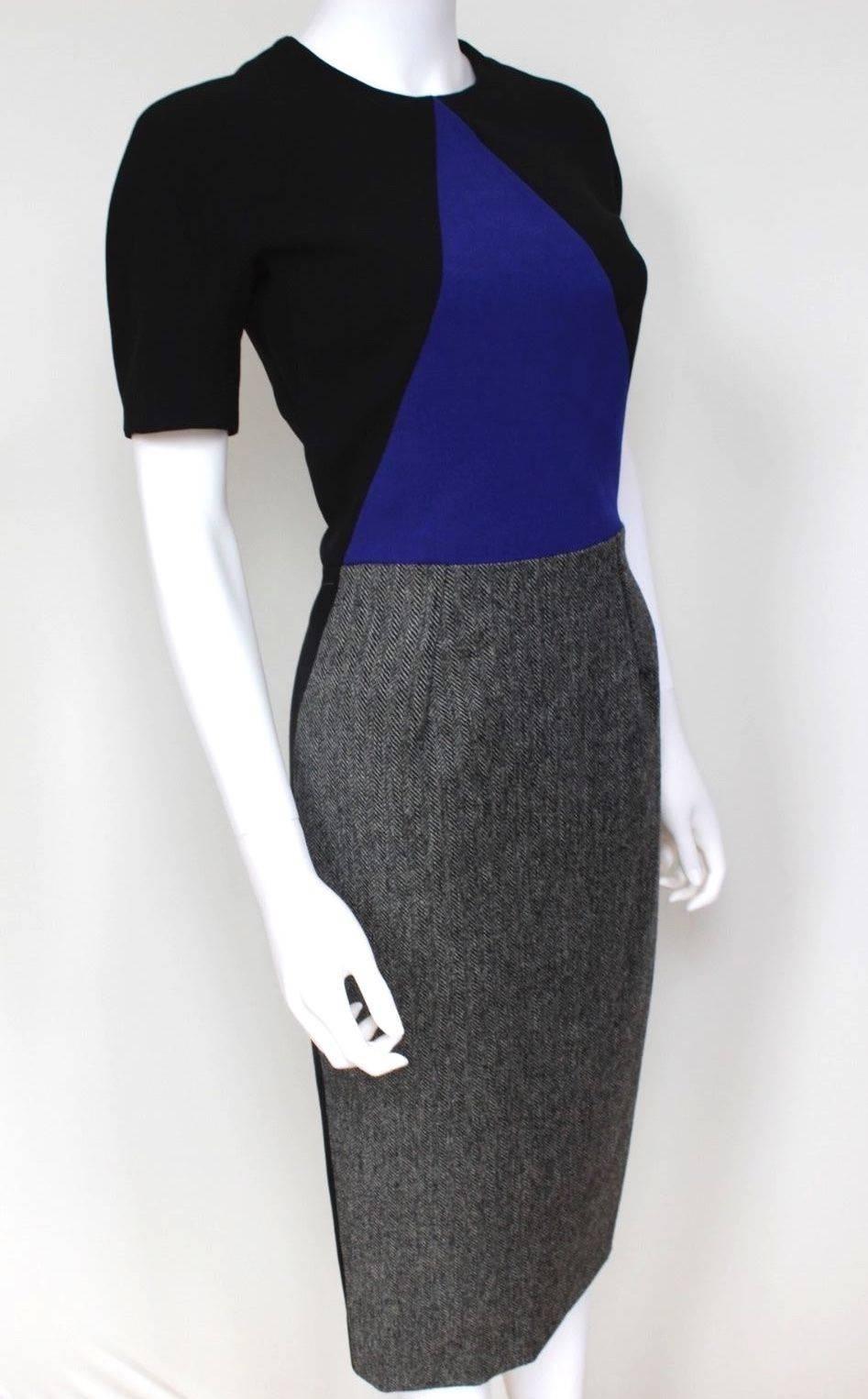 New with Tags Victoria Beckham blue triangle geometric paneled exposed zip dress UK 10-12
Victoria Beckham's black crepe dress is cut with a gray wool-tweed skirt - a striking contrast to the cobalt blue paneled body. 
Balance the elegant
