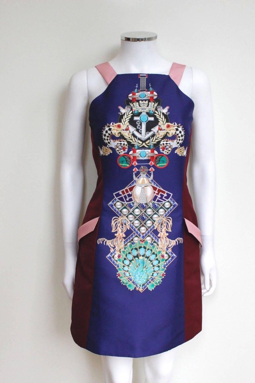 MARY KATRANTZOU Navy Fenbot Print Shift Dress uk 8 
 Multi 'Fenbot' dress from Mary Katrantzou featuring a square neck, darts to the chest, a sleeveless design, front flap pockets and a short length
Length 33 inches, chest 16 inches across, waist 13