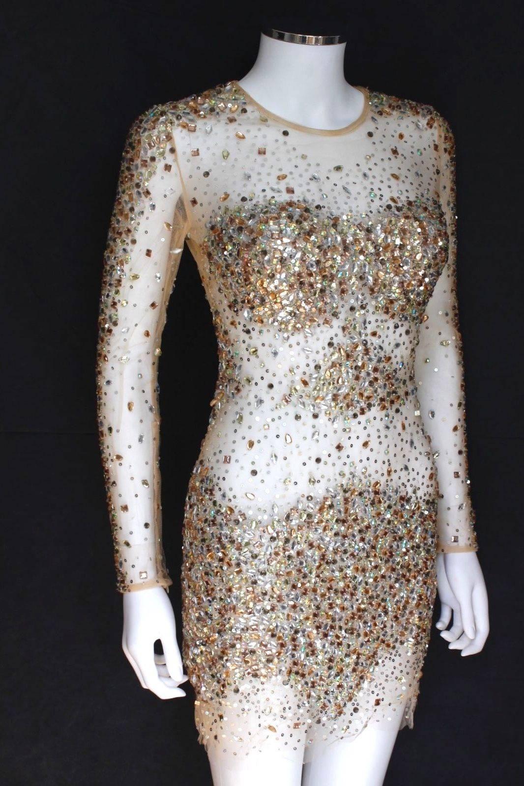 Authentic Jovani Sexy Sheer Crystal Long Sleeve Mesh Dress US 6 uk 6-8 
Beautifully created, this dress is made of the most intricate detail of crystal gems
One of the most worn by celebrities worldwide – This stunning Jovani beautiful sheer long