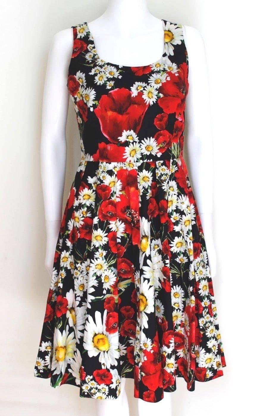 DOLCE & GABBANA 2016 Daisy and Poppy Print Cotton Dress It 42 Uk 10 
Blooming floral print and a classically feminine silhouette insist this Dolce & Gabbana dress is a smart investment for any girly girl.
Multicoloured cotton floral print dress from