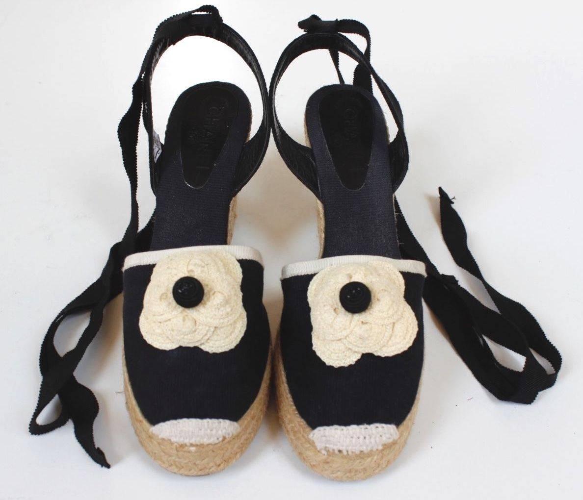 CHANEL Black Canvas Camellia Ankle Wrap Espadrille Wedges Size 38 uk 5 

These chic and easy-to-wear Chanel wedges are a great addition to any wardrobe and perfect for warm weather! 

These espadrilles feature a raffia wedge and an adorable cream