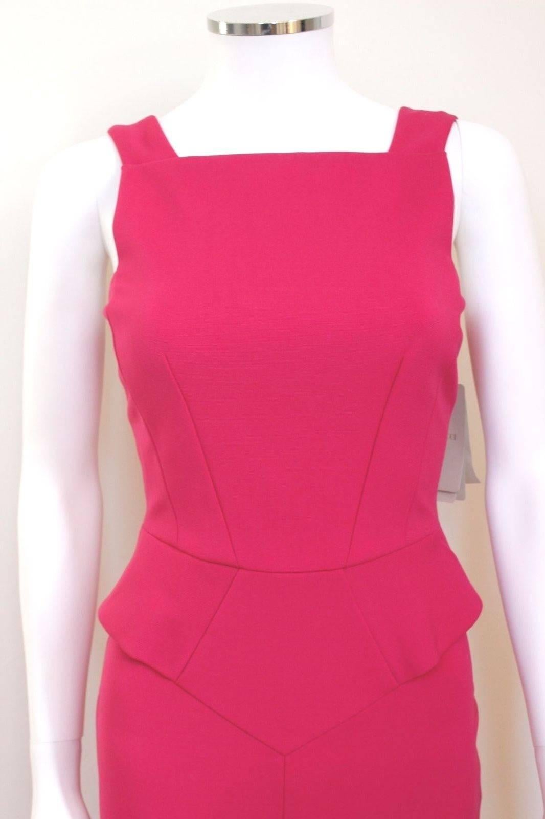 New EMILIO PUCCI Fuchsia Pink Stretch Dress IT 40 uk 8
Gorgeous electric fuschia sleeveless sheath dress by EMILIO PUCCI. 
In a thick stretch knit, this bodycon style features a square neck, and slinky pencil skirt with peplum stitching at the
