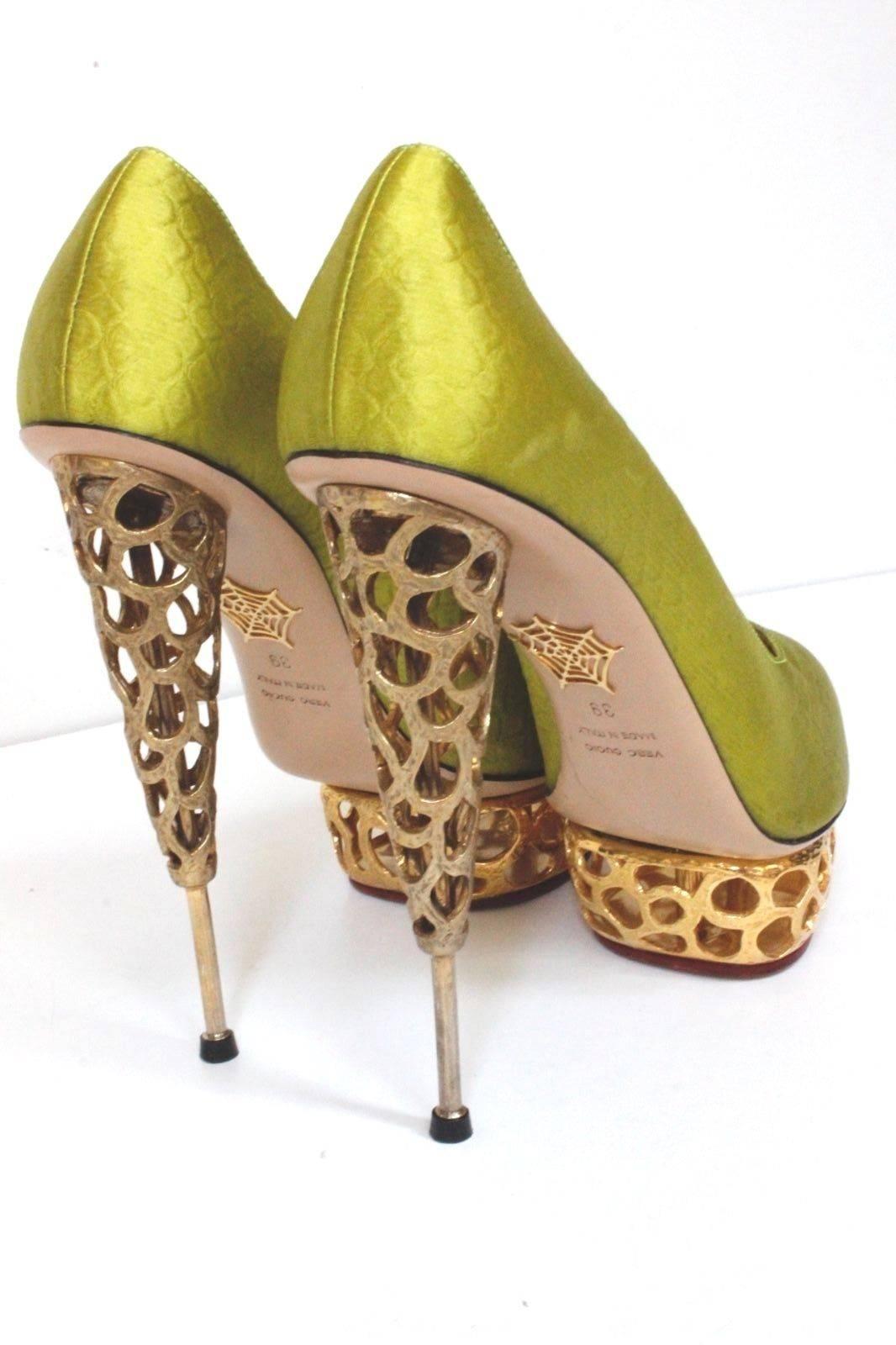 New CHARLOTTE OLYMPIA Chartreuse 'Objets D'Art' pumps 39 uk 5-6 
True to its rarefied name, a stunning round-toe pump done in chartreuse satin rests regally atop a honeycomb of golden hardware (that takes seven days to craft) for a look that can