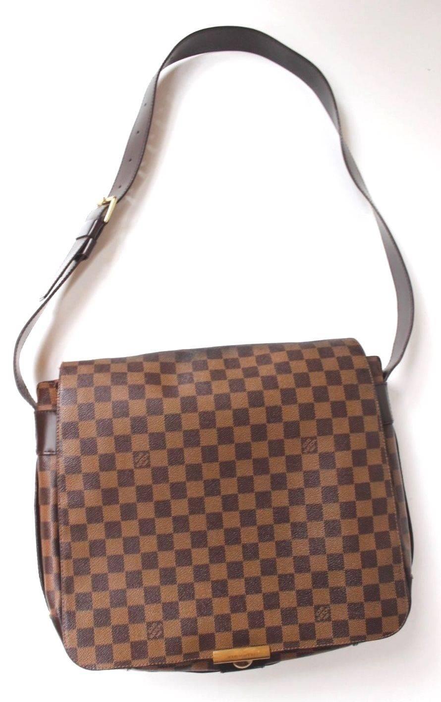 Louis Vuitton Damier Ebene Canvas Bastille Messenger Bag
This is an authentic Louis Vuitton Damier Ebene Canvas Bastille Messenger Bag. 
Made in damier canvas, this shoulder bag features gold- tone hardware and a hook closure. 
There is an exterior