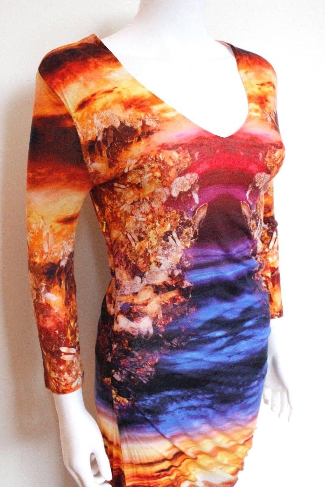 McQ Alexander McQueen Mineral Sunset Print stretch Dress M
Bright and colourful sunset print dress, viscose jersey 
Ruching to the side with 3/4 length sleeve
Concealed side zip fastening 
Length 38 inches, chest 17 inches across, waist 13 inches,
