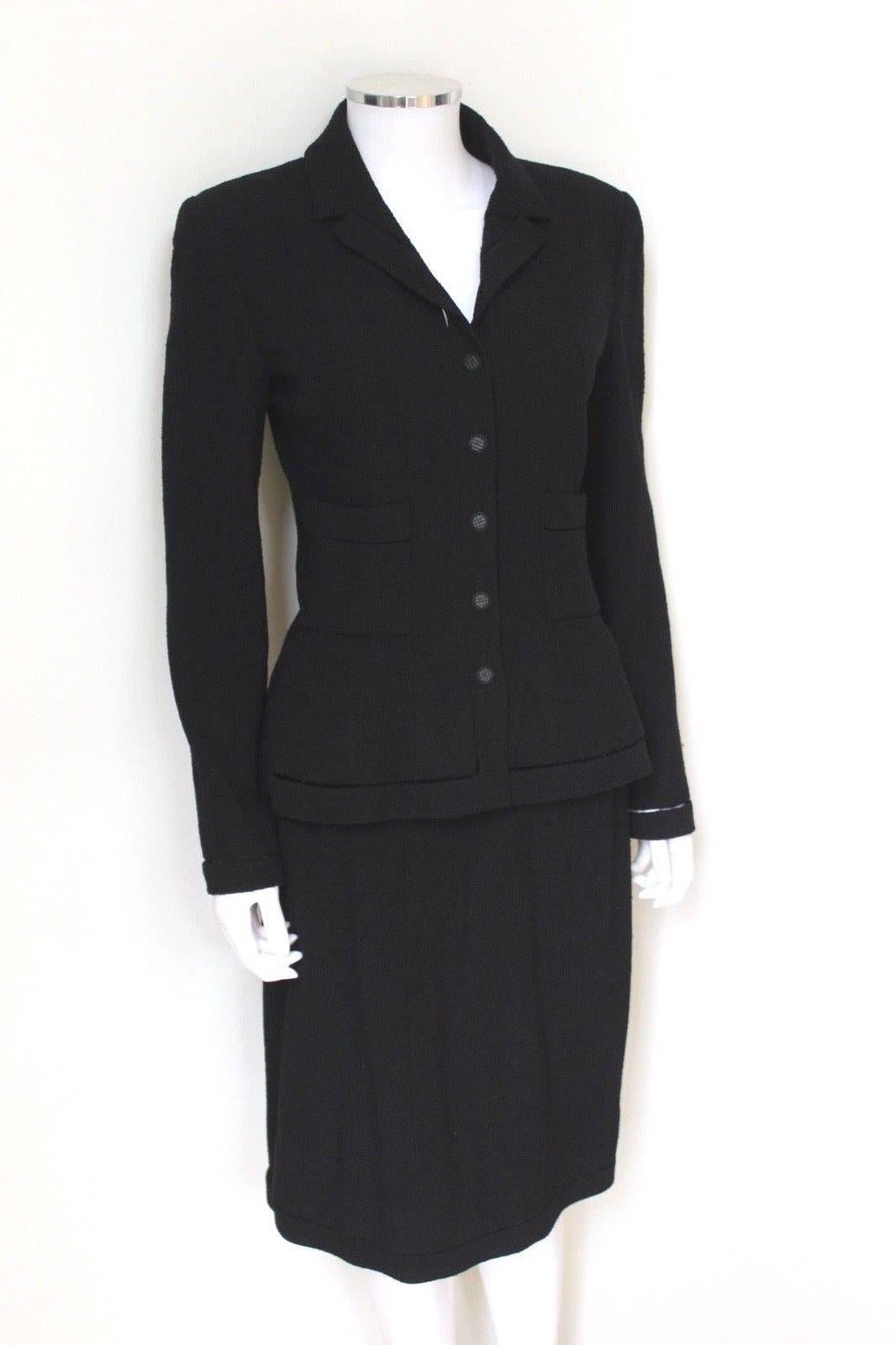 Chanel Black Classic Skirt Suit Jacket F38 uk 10 
This is a flattering fitted cut with logo buttons to the front 
Split trim to the hems, detail can as seen in the last photos 
Lined in silk with chain to the hem 
94% Wool 6% Polyester
Jacket length