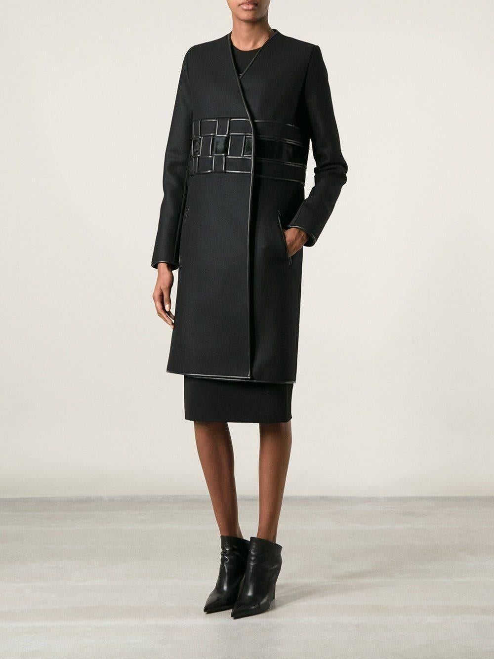 New DAVID KOMA Leather Wool Fur Woven Detail Coat UK 10 
Black wool blend and calf hair woven detail coat from David Koma featuring a v-neck, a wrap style front, a woven design.
 Concealed front fastening, side slit pockets, long sleeves and a