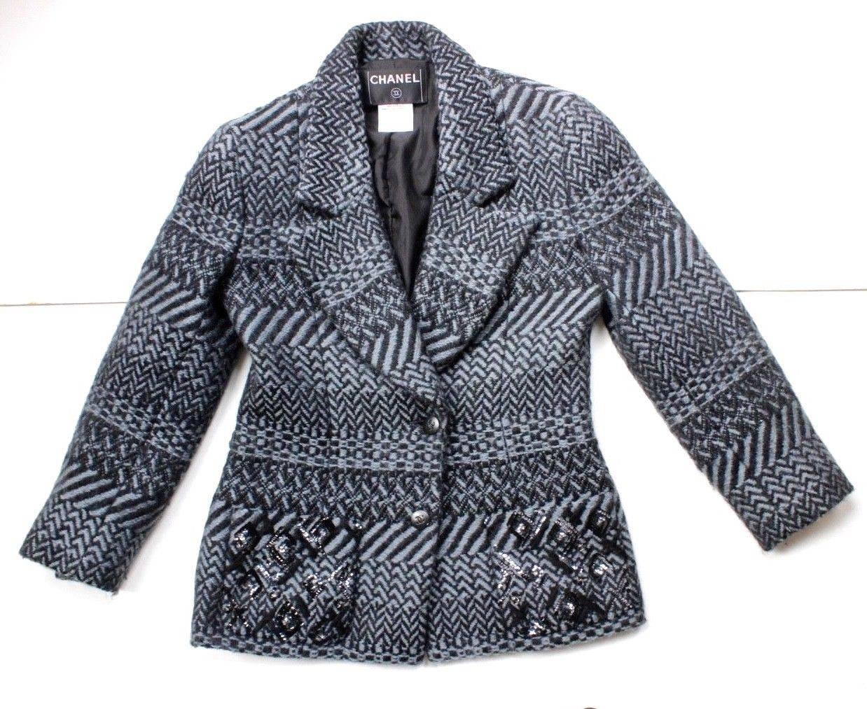 Authentic Chanel Blue Chevron Wool Sequin Jacket F 38 uk 10
Stunning Jacket from Chanel in in black and blue cheveron stripes 
Black logo buttons with sequins to the pockets 
Lined in silk with chain to inside hem 
Length 25 inches, chest 18 inches