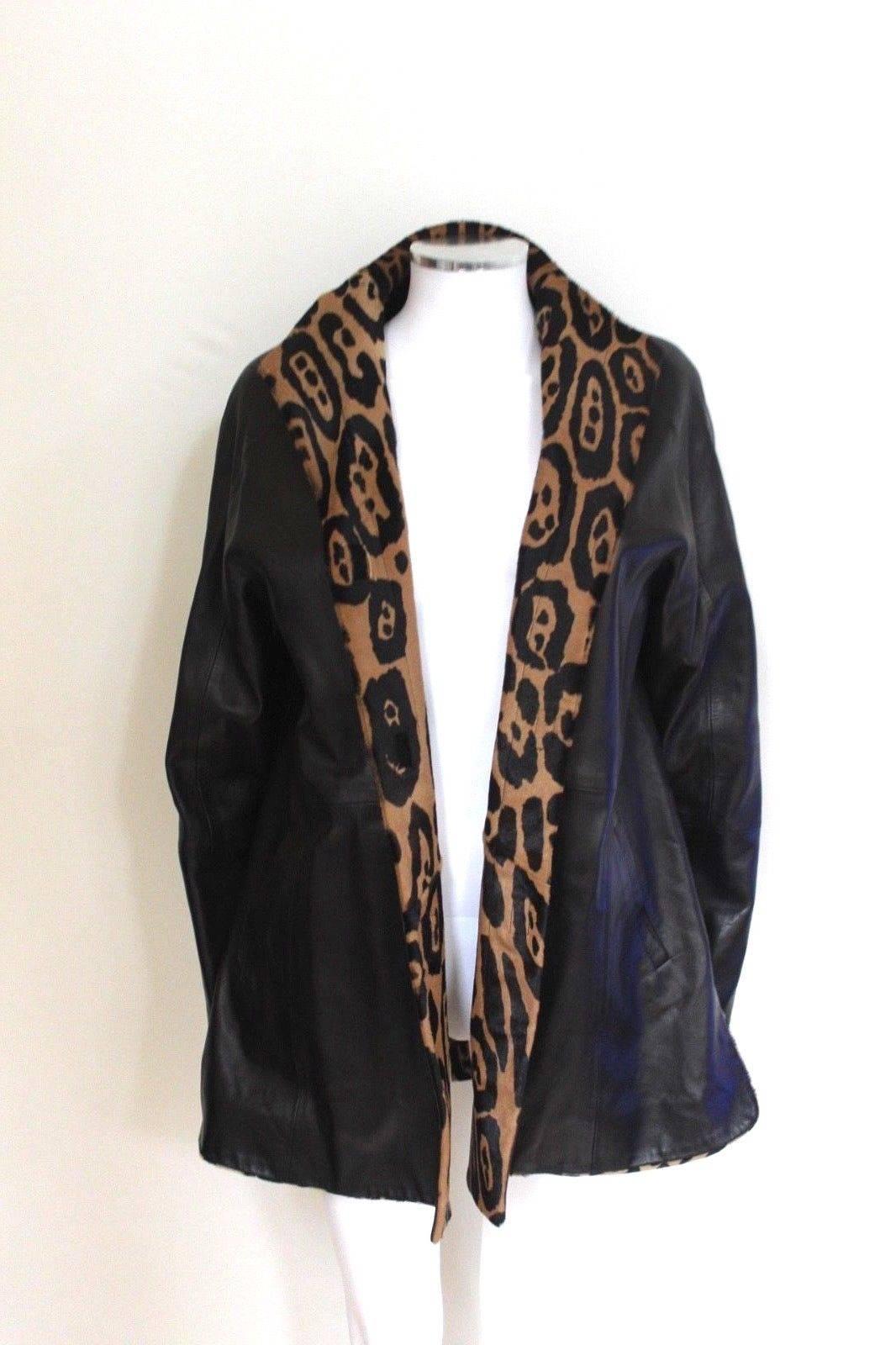 Jitrois Black Leather Leopard Fur Trim Jacket 40 uk 12
Black leather jacket with velcro fastening 
 Swing style coat, fully lined 
Length 30 inches, chest 20 inches across laid flat.
Excellent condition, a few small scratches to the side as seen in