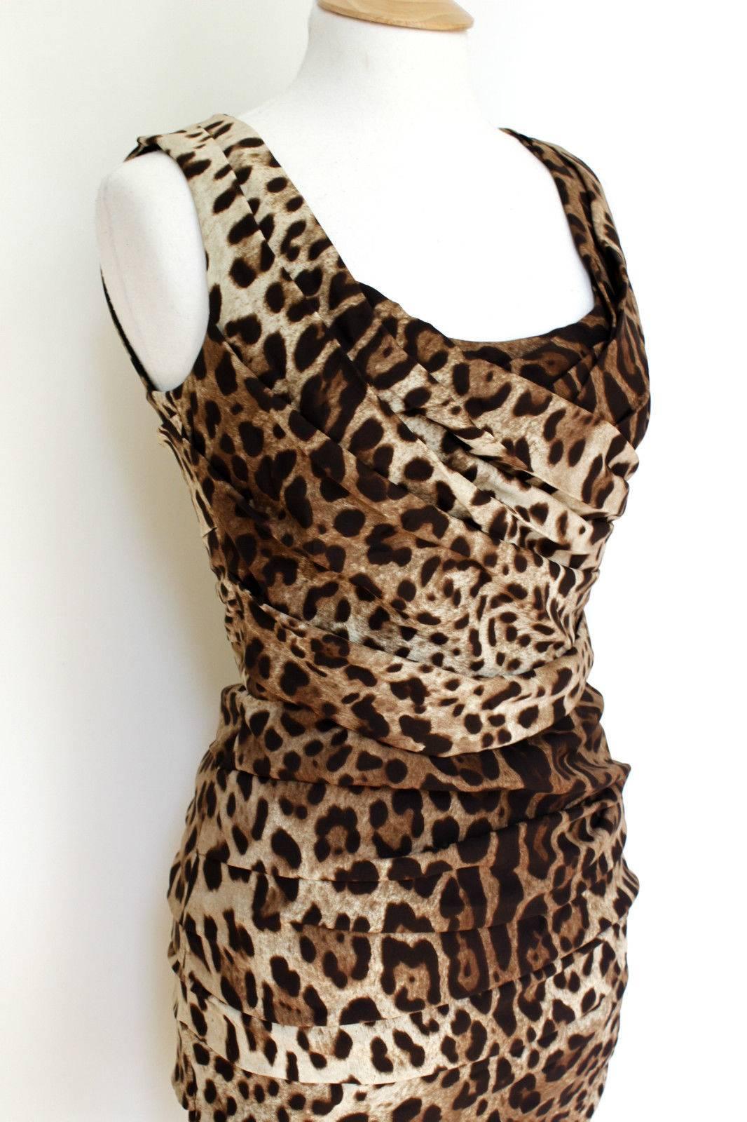 £1100 Dolce & Gabbana Leopard Print Dress 44 UK 12
Beautiful gathered leopard print silk dress
Below the knee. Fully lined. ziped at the back 
96% Silk  4% Elastane
Length 39 inches, Chest 19 inches, waist 14 inches, hips 18 inches across laid flat