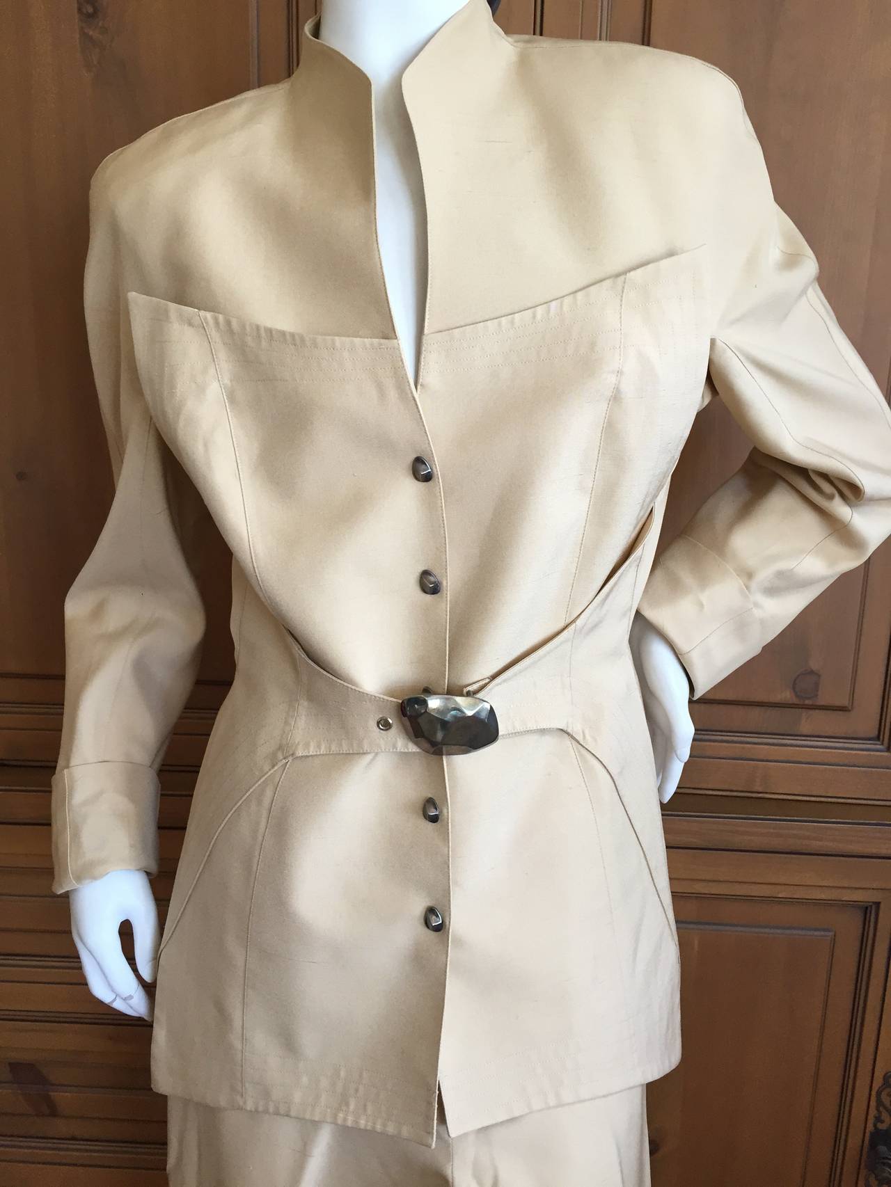 Thierry Mugler Sculptural Tan Silk Jacket with matching pants .
Featuring a snap front jacket with half belt, and a matching pair of trousers.