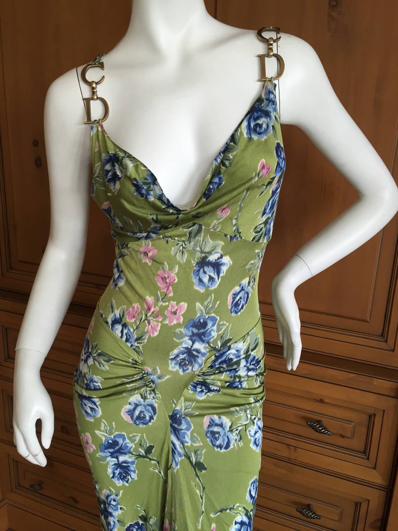 Christian Dior by John Galliano Pretty Silk Jersey Floral Dress w CD Hardware  
This type of silk jersey is very delicate, and my rough finger caused a small snag on the bust , see last photo, otherwise excellent
sz 38
Bust 38