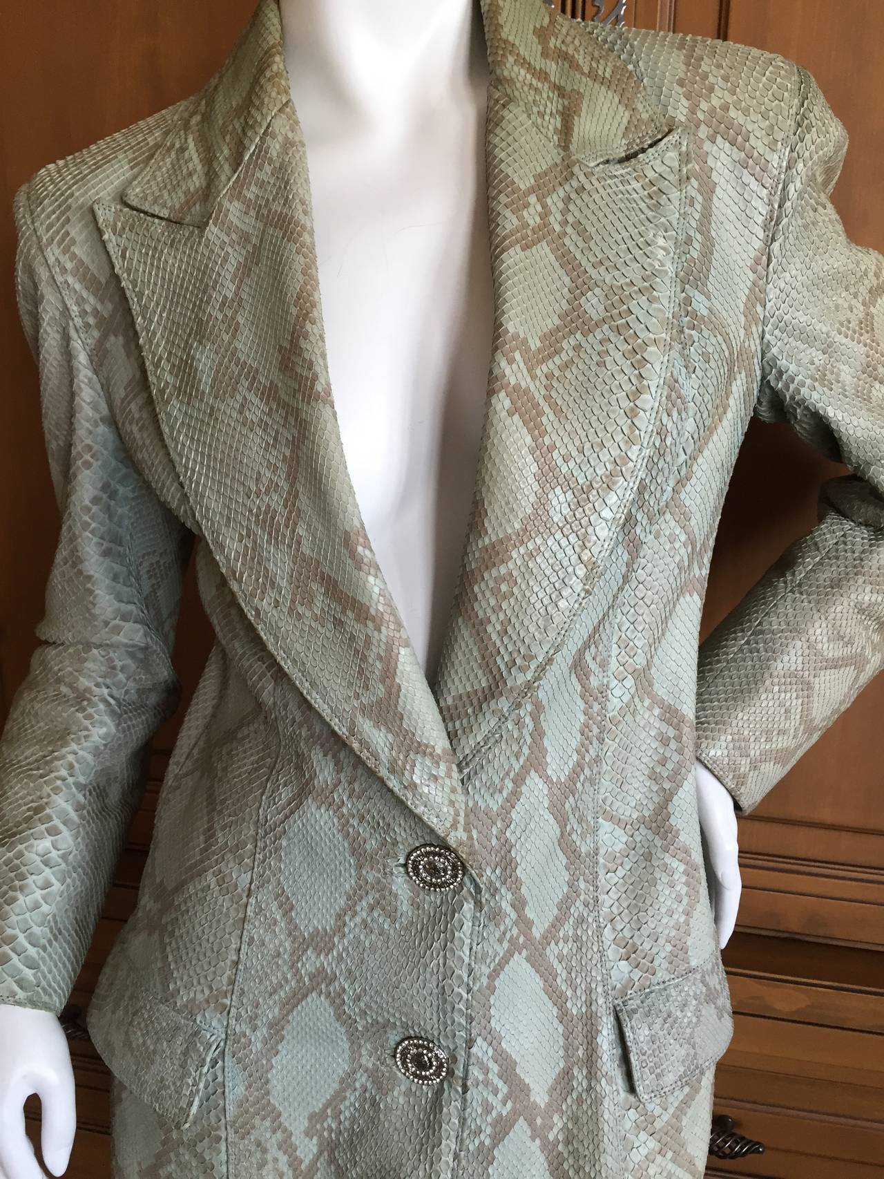 Gianni Versace Couture VIntage Genuine Python Jacket / Coat circa 1990
This is a wonderful vintage Versace, lined in Medusa pattern fabric with crystal Medusa

  
BUST:	34 in. (86 cm)
WAIST:	28 in. (71 cm)
LENGTH:	37 in.