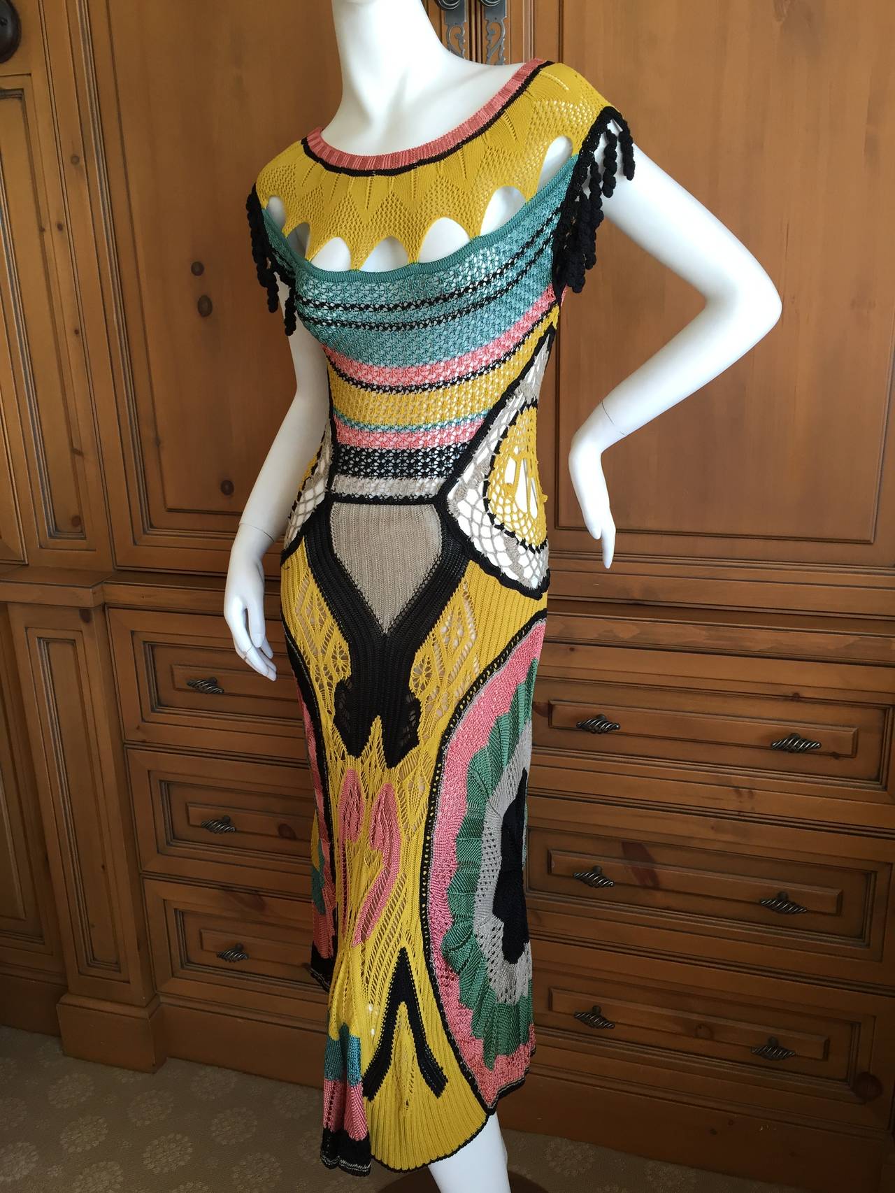 Jean Paul Gaultier Crochet Multicolor Dress.
This is such a great dress, a delightful tribute to the genius of JPG.
The side panels spell JPG in detail.
There is a lot of stretch in this .