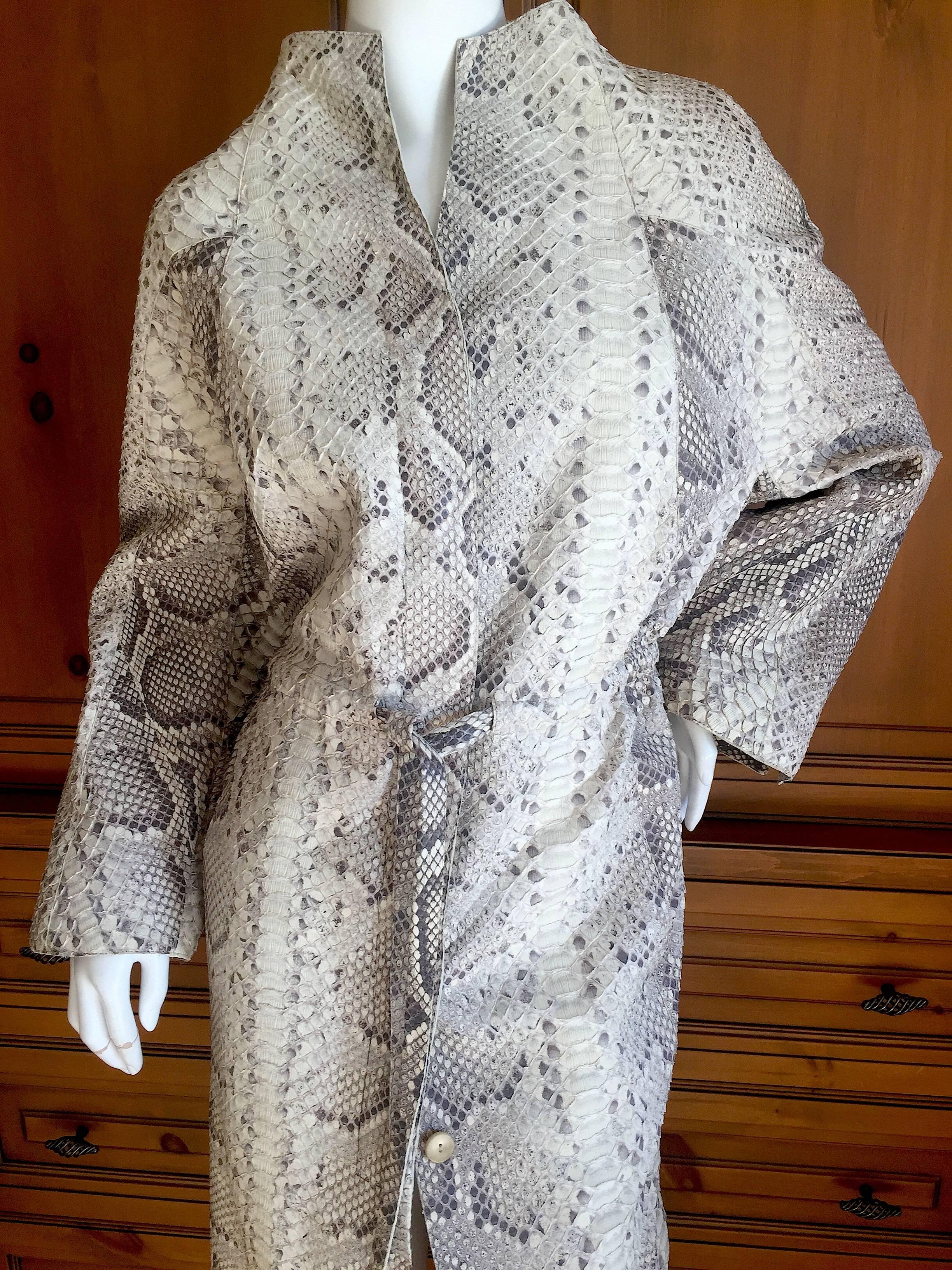 Wonderful genuine python coat from Ralph Rucci Chado.
Simple, elegant , luxurious pure Ralph.
Lined in silk.
Retail $11,000.
Two side pockets and a cinch waist, this is a hard to find larger size.
Bust 48