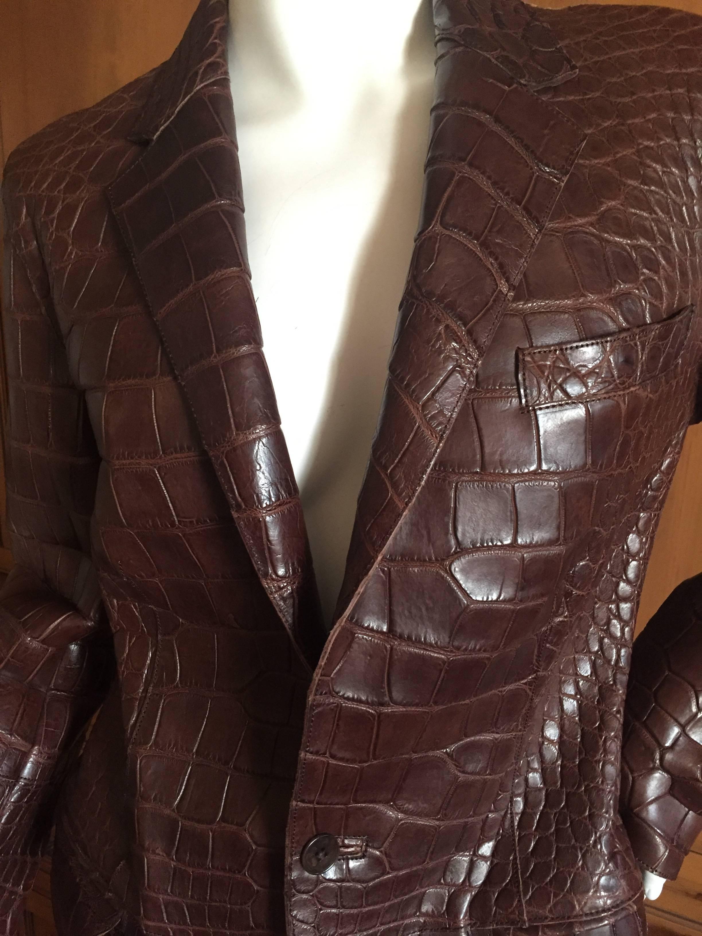 Ralph Lauren Purple Label Vintage Crocodile Embossed Leather Jacket
Size 10
This looks like genuine crocodile, however the label reads leather.
The sleeves are very long, I'm not certain if they were designed to rollup, but the sleevs are