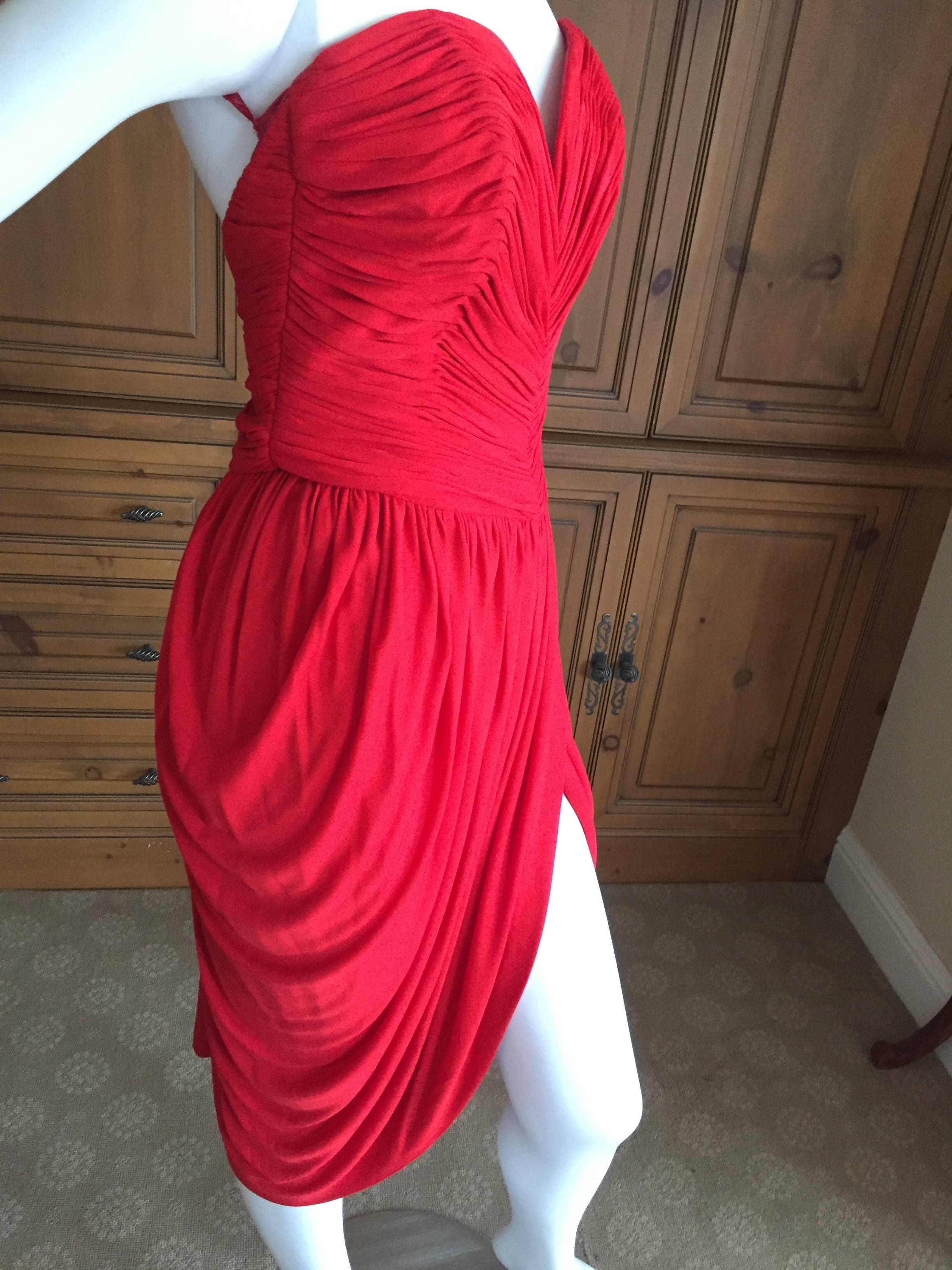 Vicky Tiel Sexy Red Cocktail Dress.
Shirred and pleated with a high slit at the skirt, this is  a knockout from Vicky Teil Paris.
Bust 34