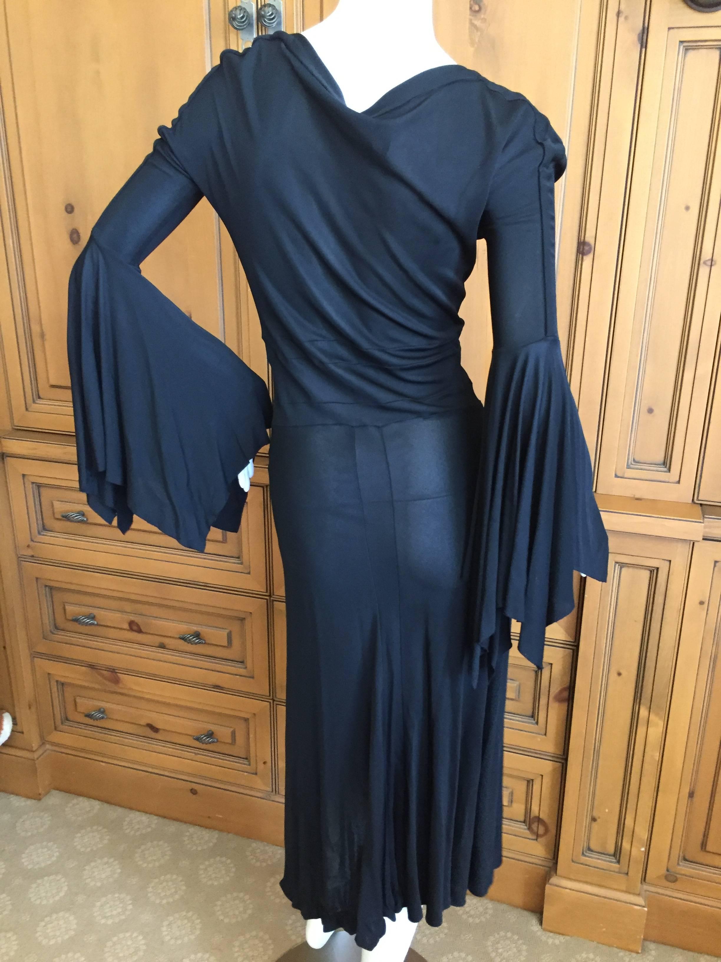 Wonderful low cut dress with bell sleeves from Tom Ford for Yves Saint Laurent.
Size Small
Bust 34”, Waist 24”, Hip 34”, Length 47”