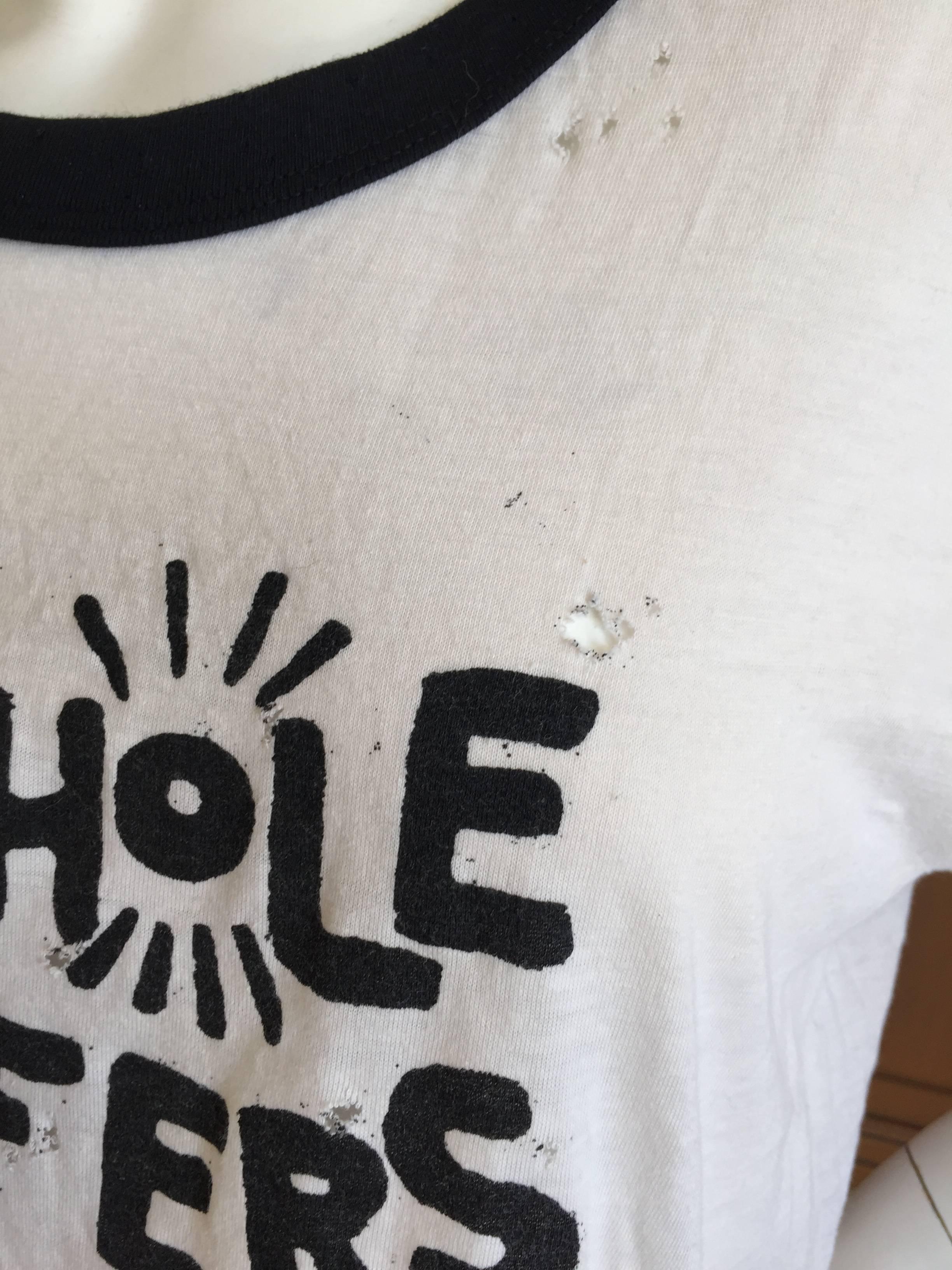 For those of us old enough to remember to remember, the Butthole Surfers were really hot in the late seventies in the east village. This is a classic punk tee shirt, full of holes and attitude.
XL
Bust / Chest 42