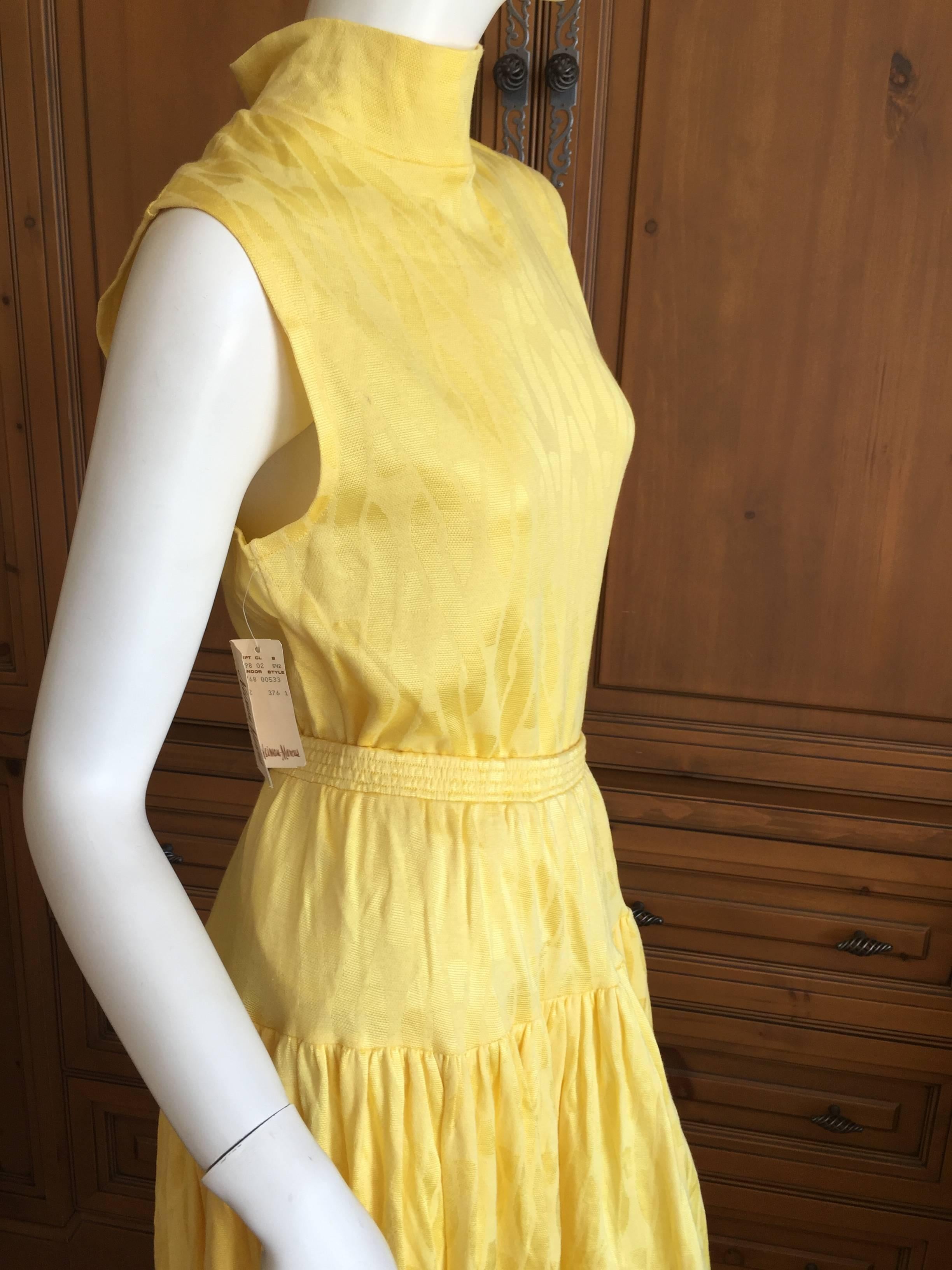 Wonderful full skirt and matching sleeveless top from Todd Oldham .
WIth Neiman Marcus tags still attached to both pieces, , this is unworn.
Yellow with a chain motif 60% cotton 40% rayon , Made in the USASkirt marked large top marked medium
Bust