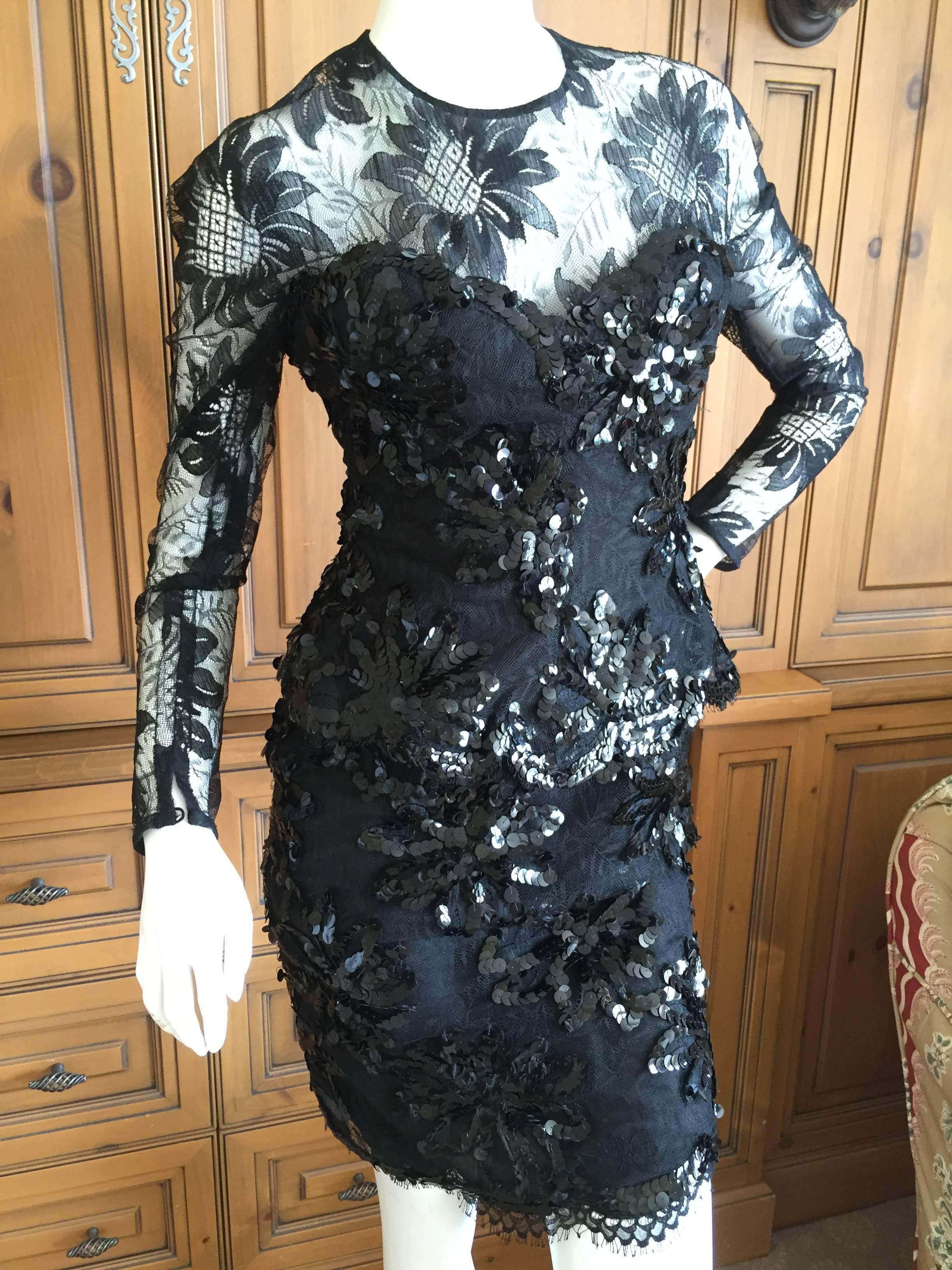 Exquisite little black cocktail dress by Gianfranco Ferre for Christian Dior.
The interior has a very intricate taffeta boned corset that is a work of art in itself.
There is a slight peplum with scalloped lace edges.
I would estimate it a size
