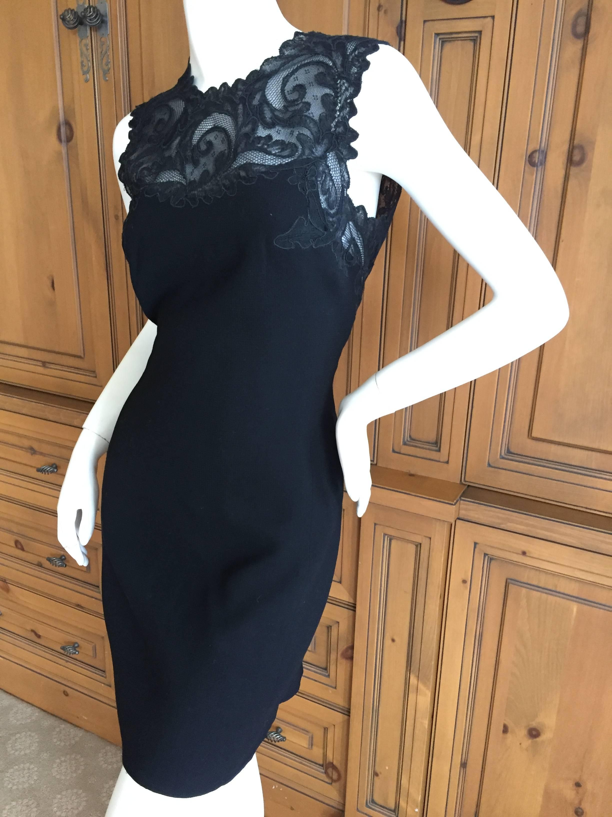 Gianni Versace Couture Lace Accented Little Black Dress.
Early Gianni Versace Couture silk lined wool dress with lace trim .
So pretty, photos don't quite capture it's charm.
Size 38

Bust 35