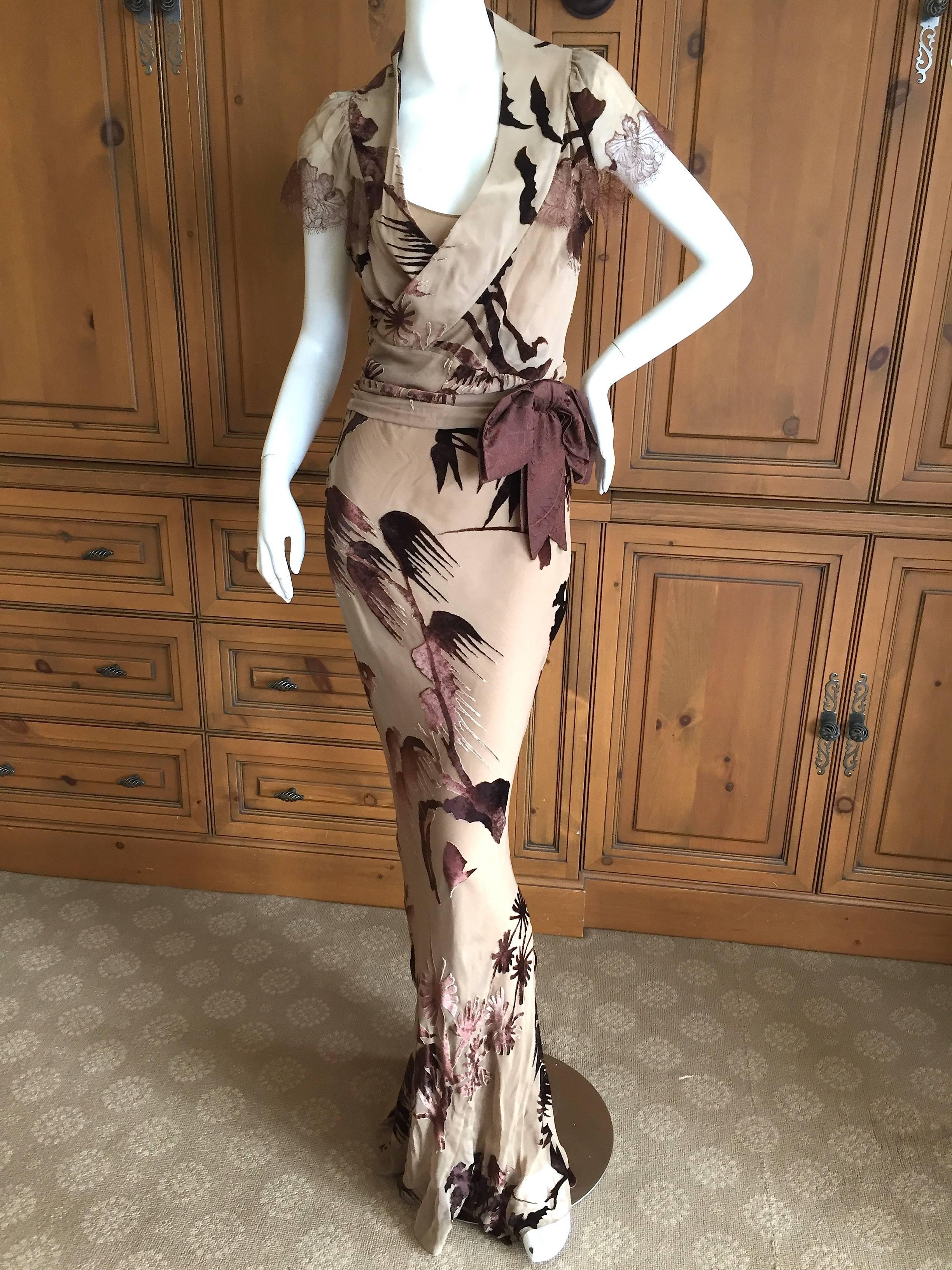 Lovely 30's style dress from John Galliano. Created in a beautiful cut velvet in a oriental foliate pattern edged in lace with a attached bow.
Marked size 40 French , US 6
Bust 40