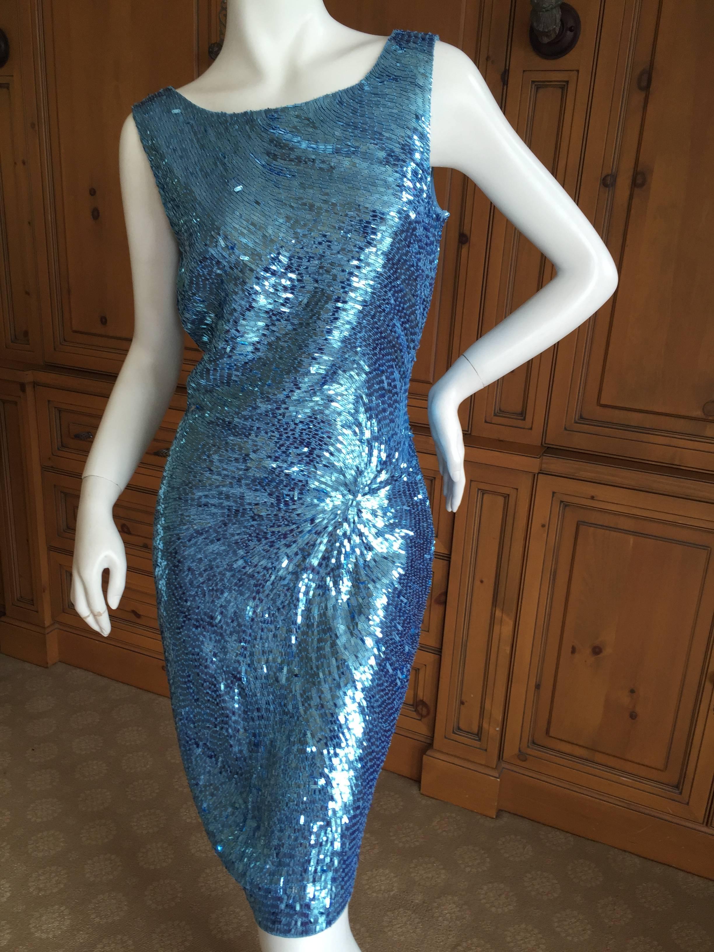 Dreamy Versace Sequin sheath dress.
The sequins swirl in a beautiful pattern, please use the zoom feature to see he details.
Size 42
There is a lot of stretch in the fabric.
Bust 38