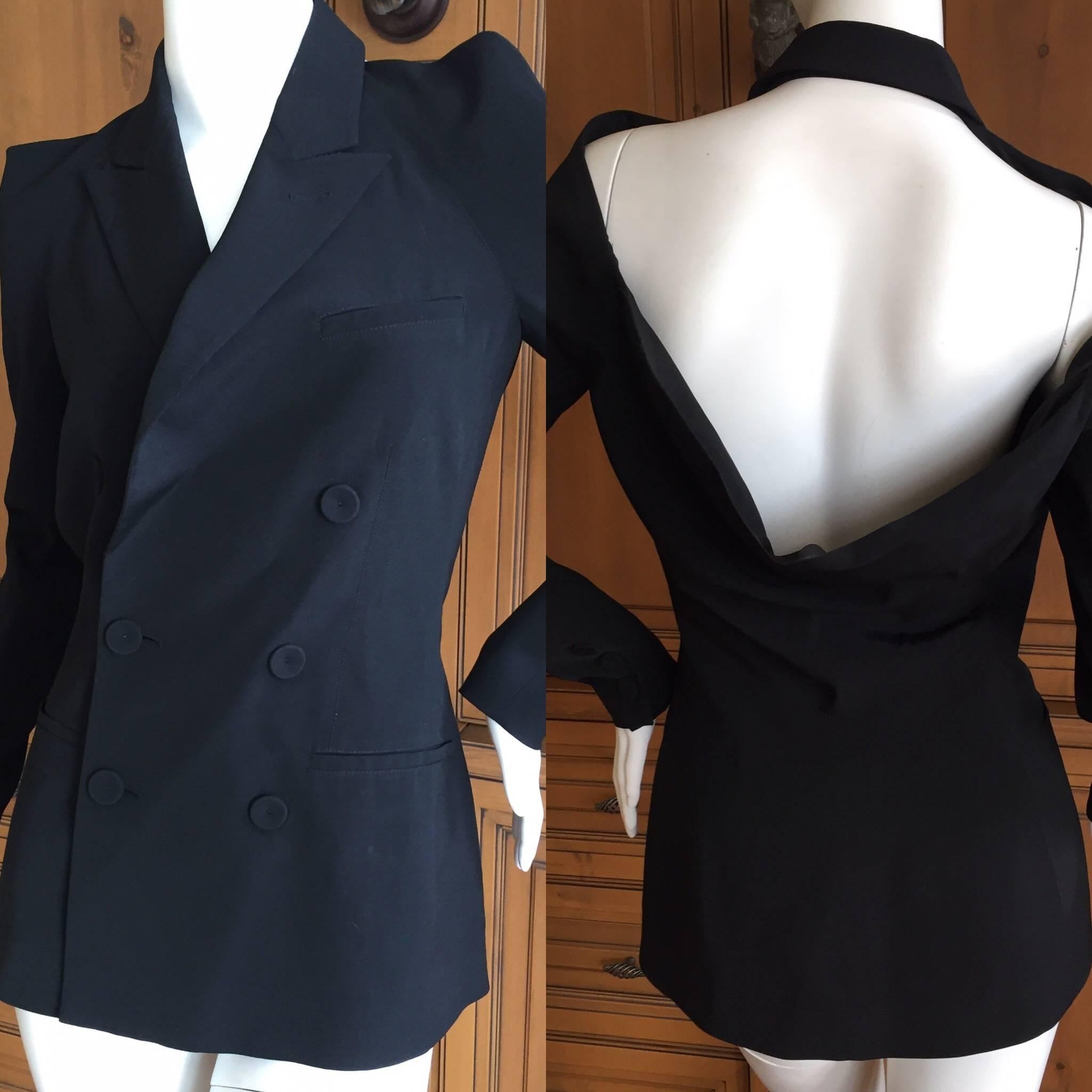 Wonderful Jean Paul Gaultier 1980's Backless Tuxedo Jacket. 
From the front this is a traditional double breasted Tuxedo jacket, but with an exposed back, so chic.
Size 36
Bust 36