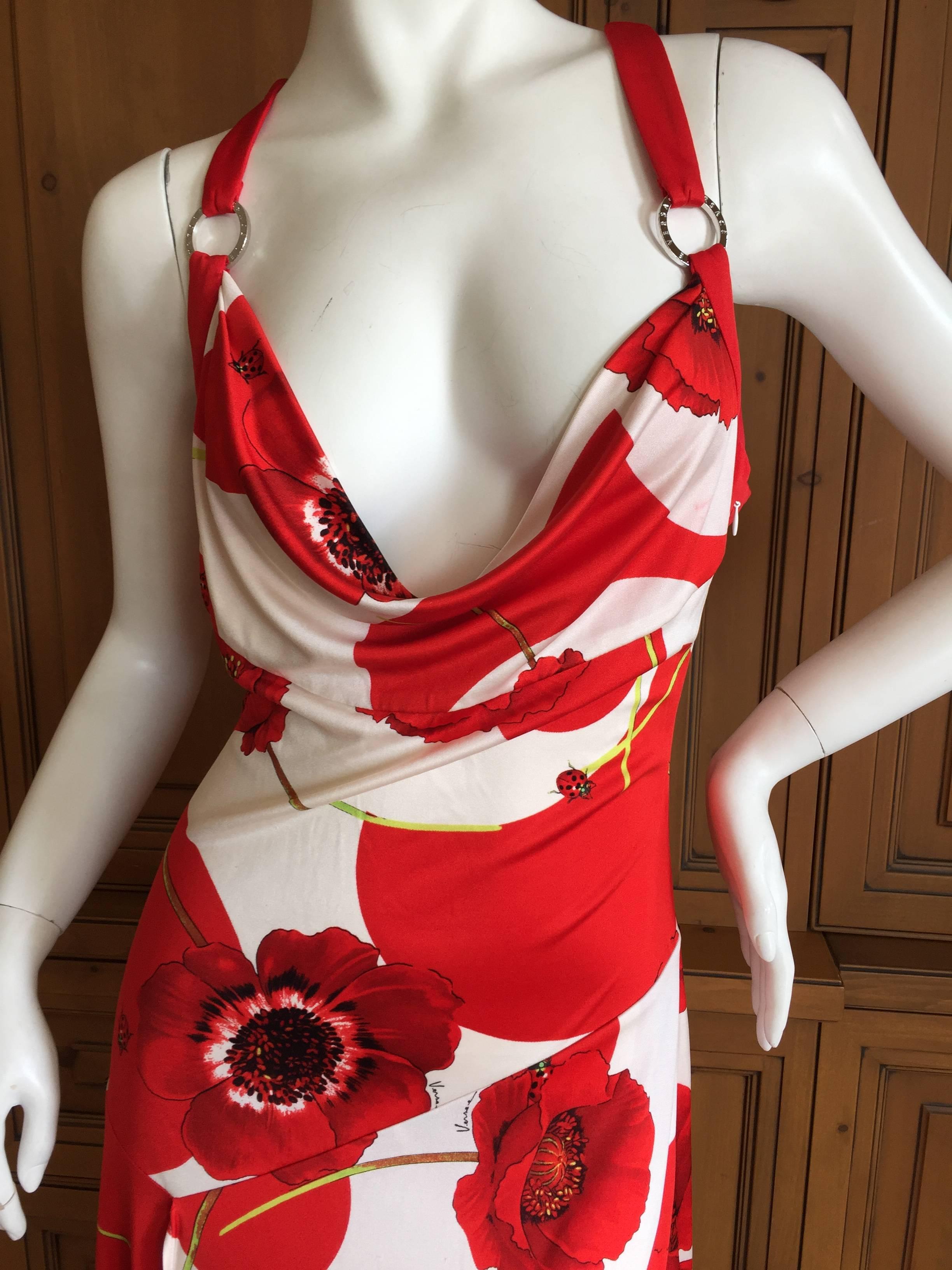 Beautiful silk jersey dress with poppies and ladybugs from Versace.

Size 42
There is a lot of stretch in the fabric.
Bust 42