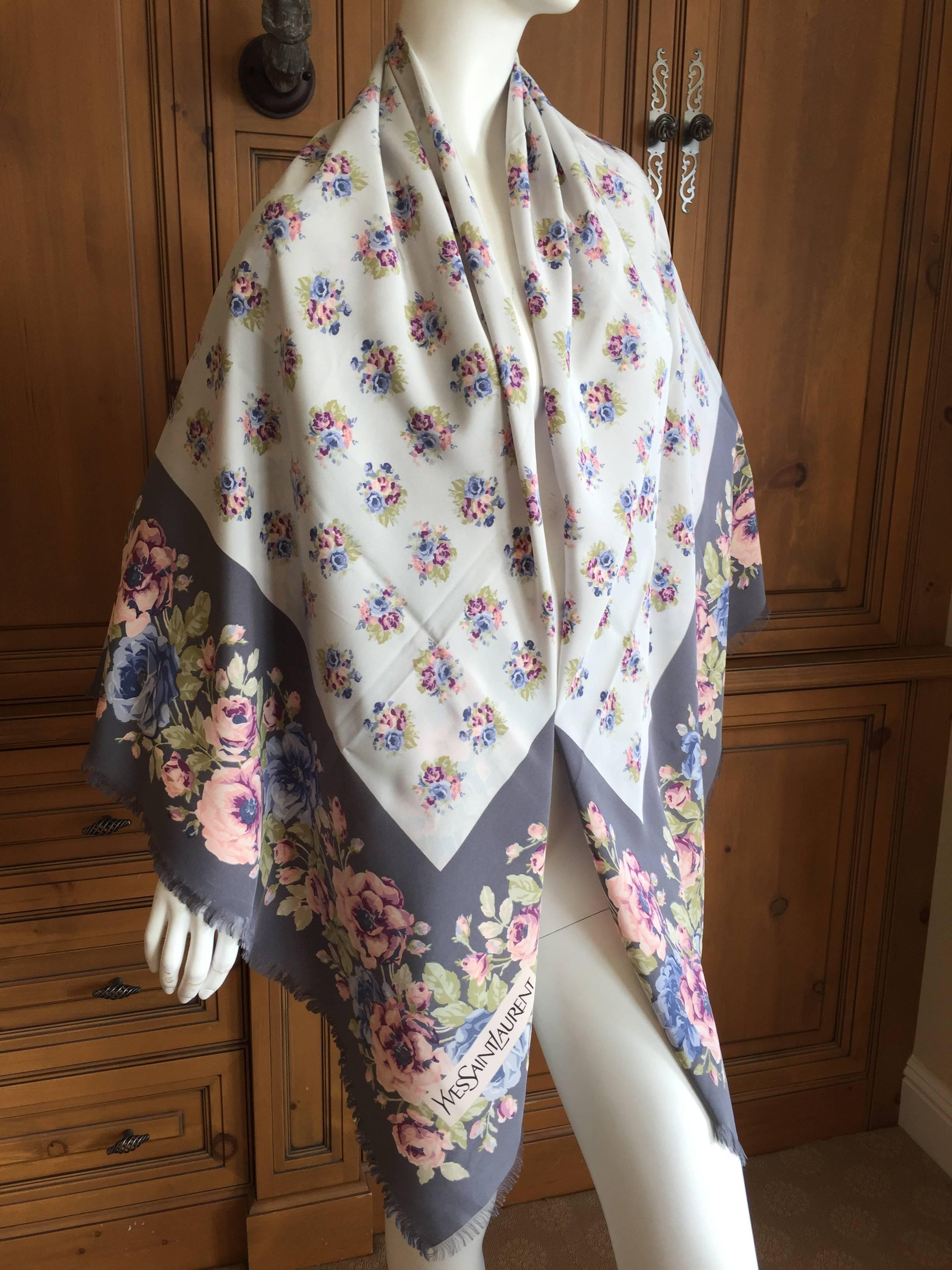 Beautiful large silk scarf from Yves Saint Laurent , prior to opening his pret a porter line Rive Gauche.
Light gray with muted florals, very pretty.
In excellent condition.
54