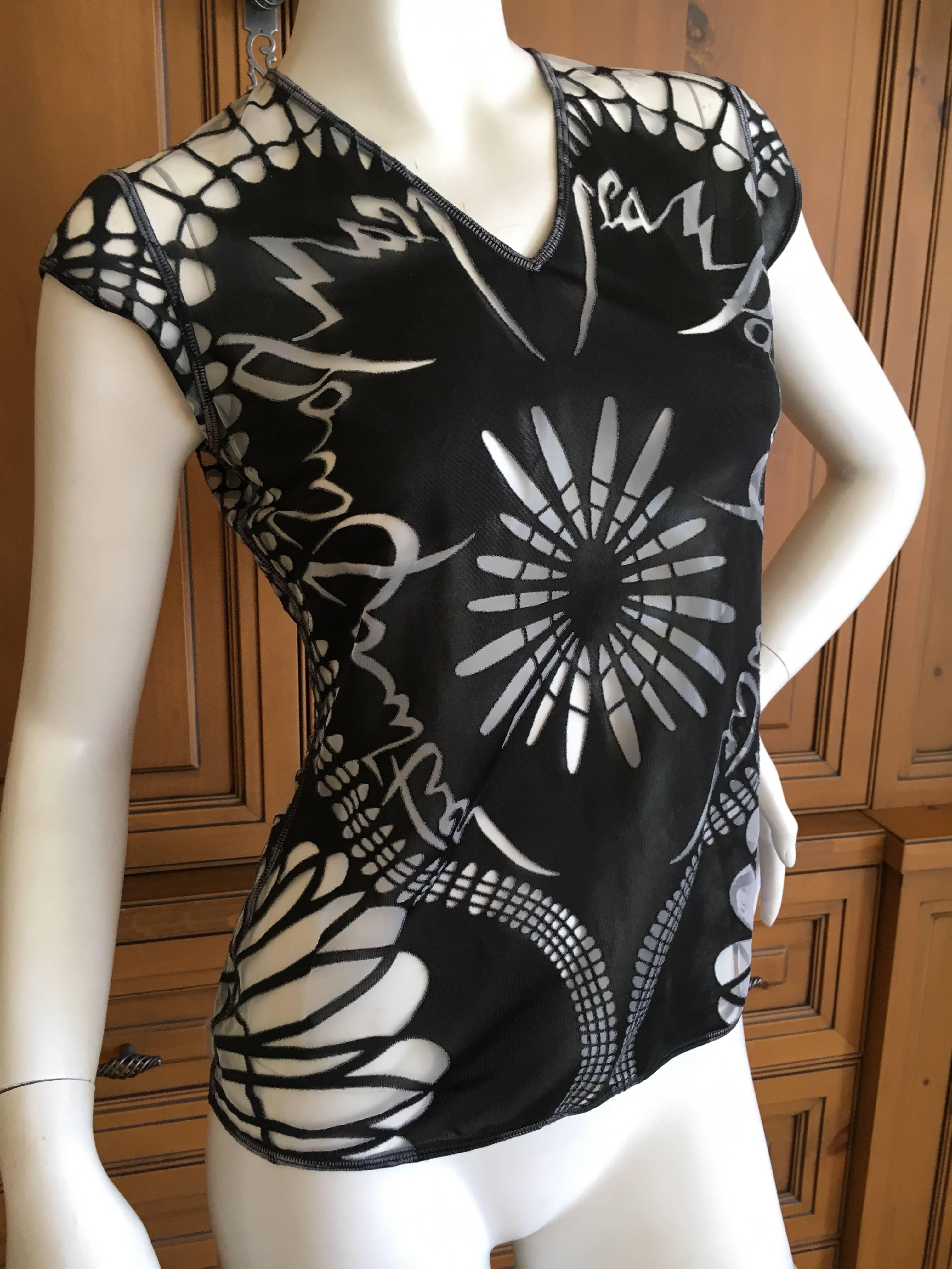 Jean Paul Gaultier Femme 1990's sheer tattoo print top.
From the Jean Paul Gaultier Maille Femme label.
Size 38
Bust 38"
Length 24"
Excellent condition