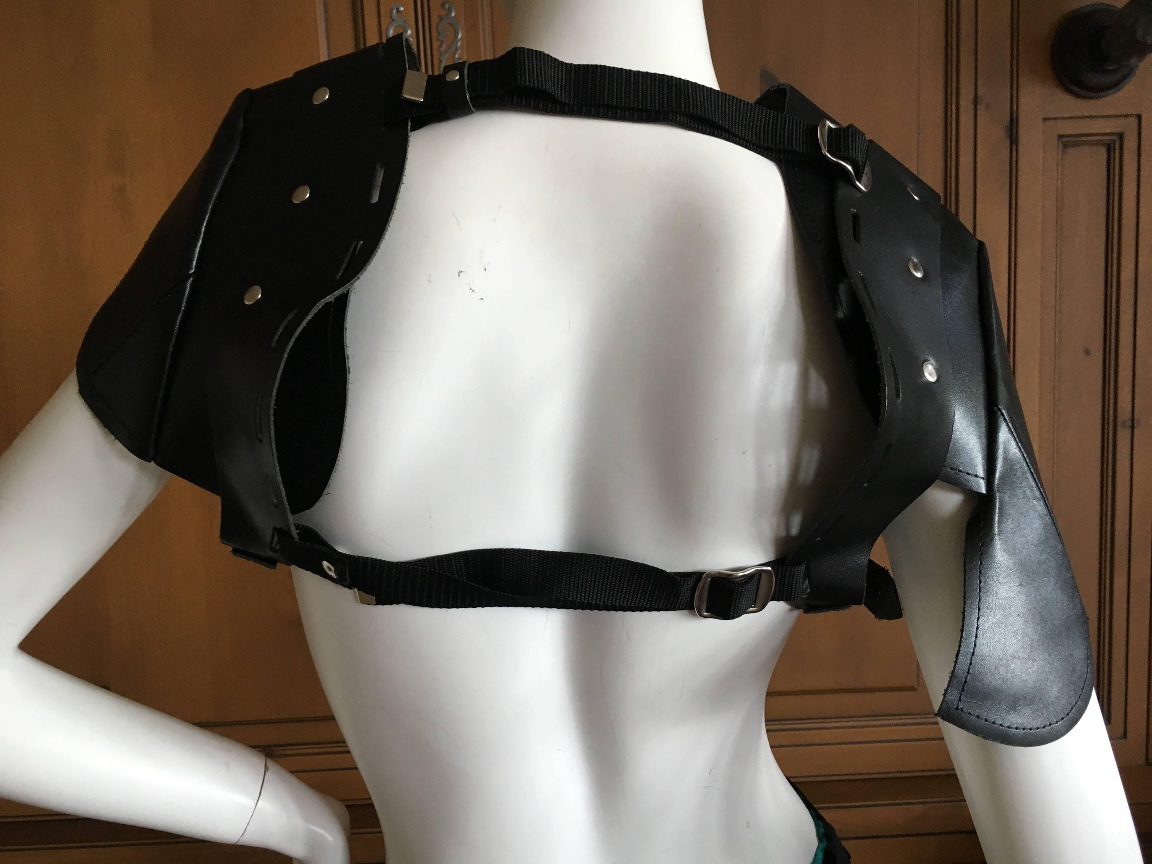Studded black leather shoulder pads from Rei Kawakubo Comme des Garcons , Fall 2010.
These are adjustable , so one size fits all.