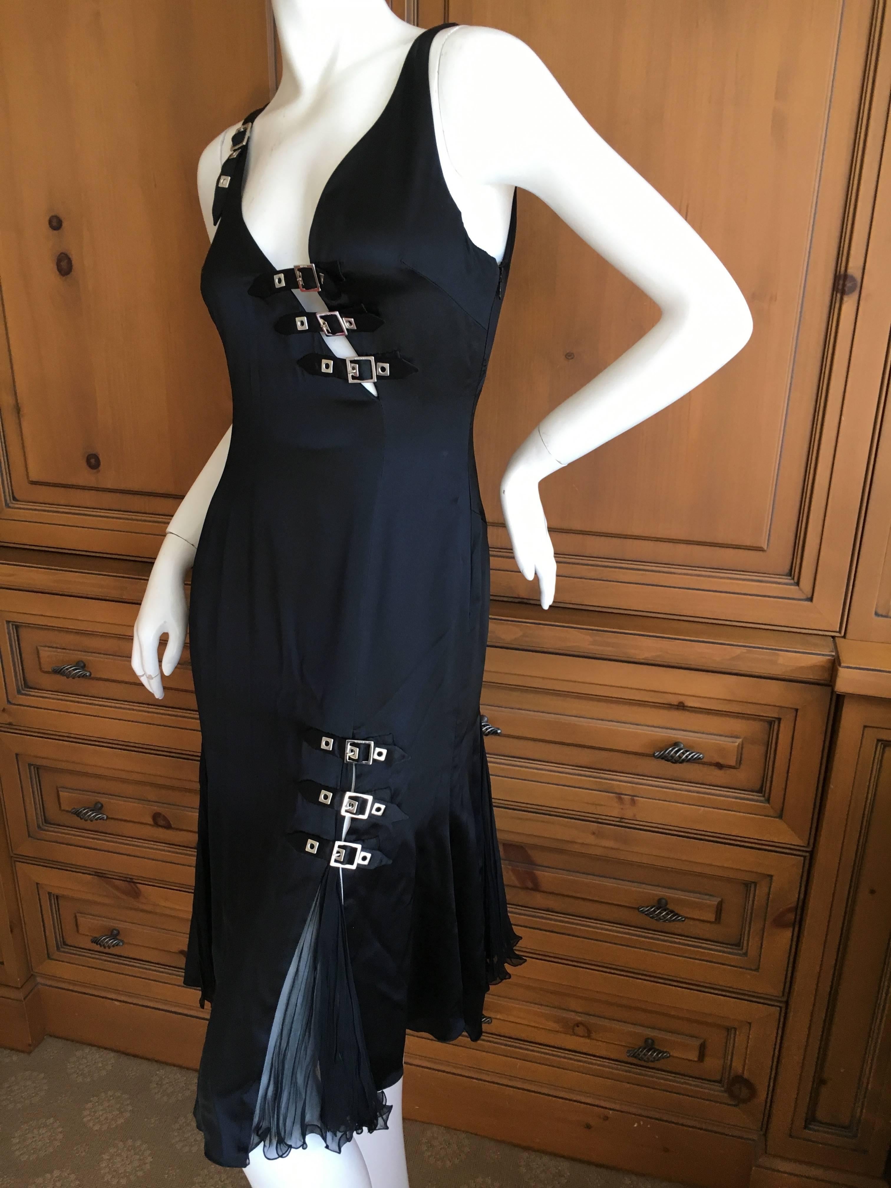 Versace Sexy Little Black Bondage Buckle Dress.
This is really sweet with seductive sheer chiffon inserts in the skirt .
Size 40
Bust 38