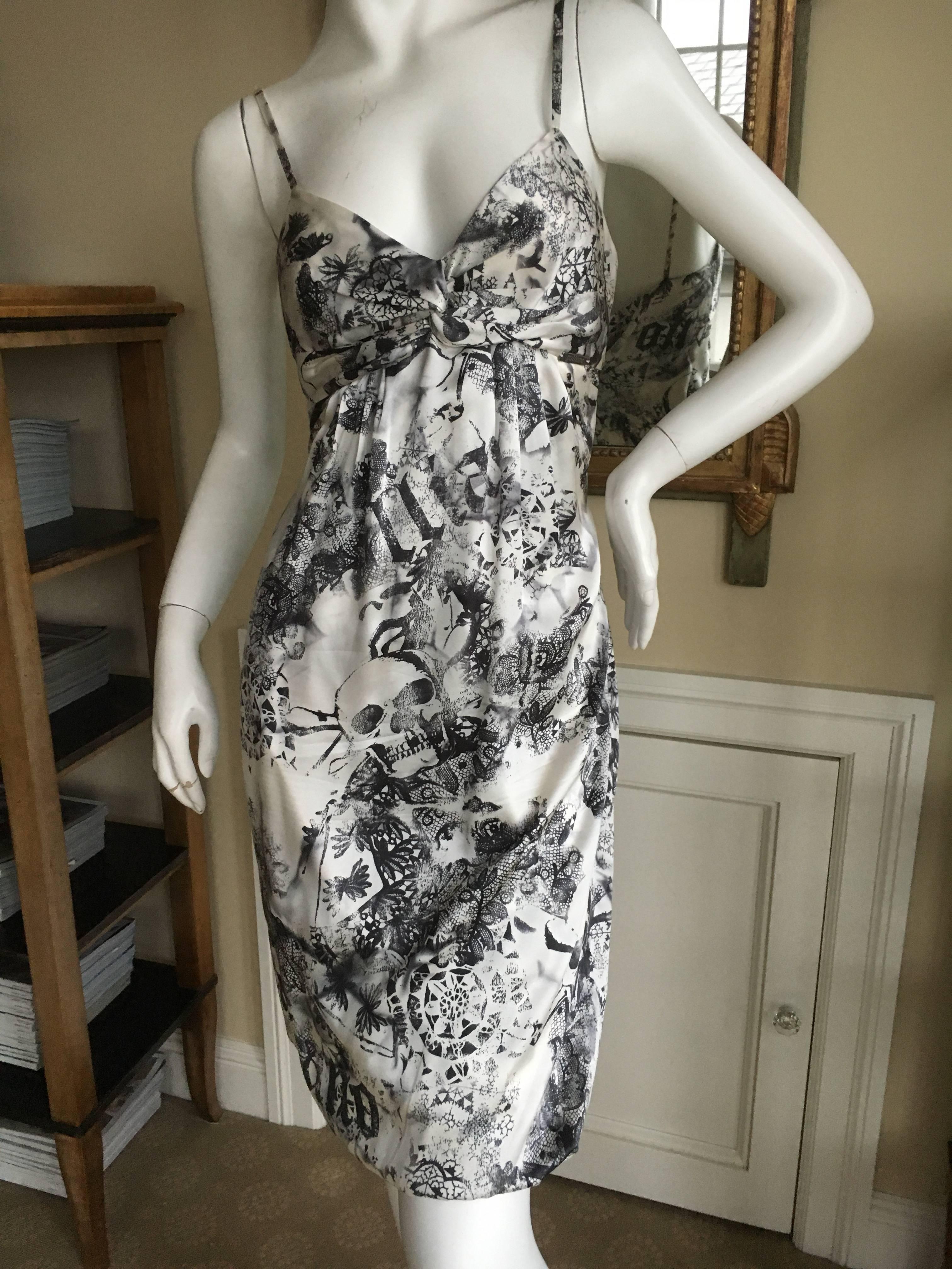 John Galliano Sweet Vintage Silk Cocktail Dress with Death Head Pattern
Size 40

Bust 36"
Waist 28"
 Hips 38"
 Length 40"
 Excellent condition
