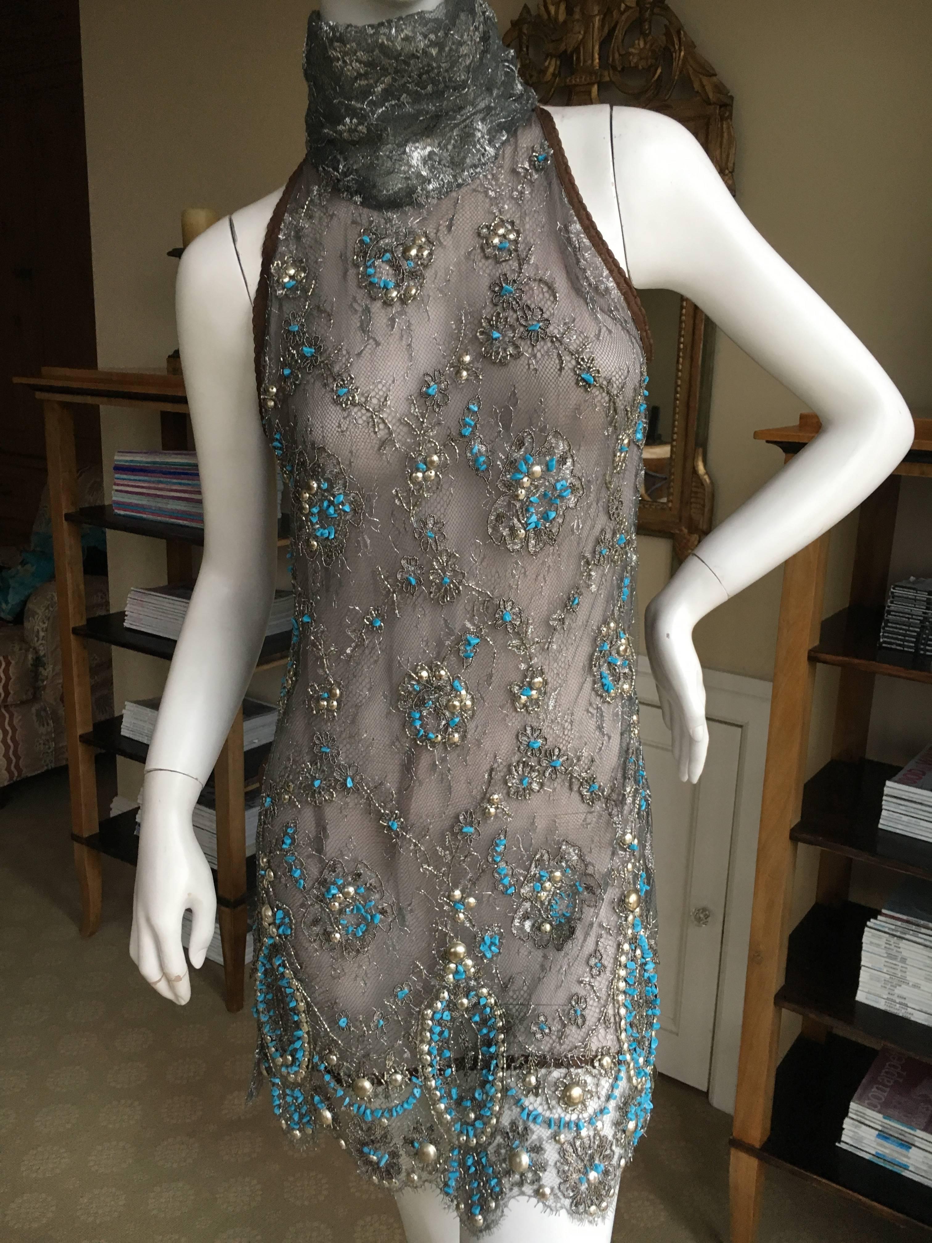 Exquisite lace tunic top from Gianfranco Ferre.
Please look at the close ups, the hand embellishments are couture quality.
Size 40
Bust 38