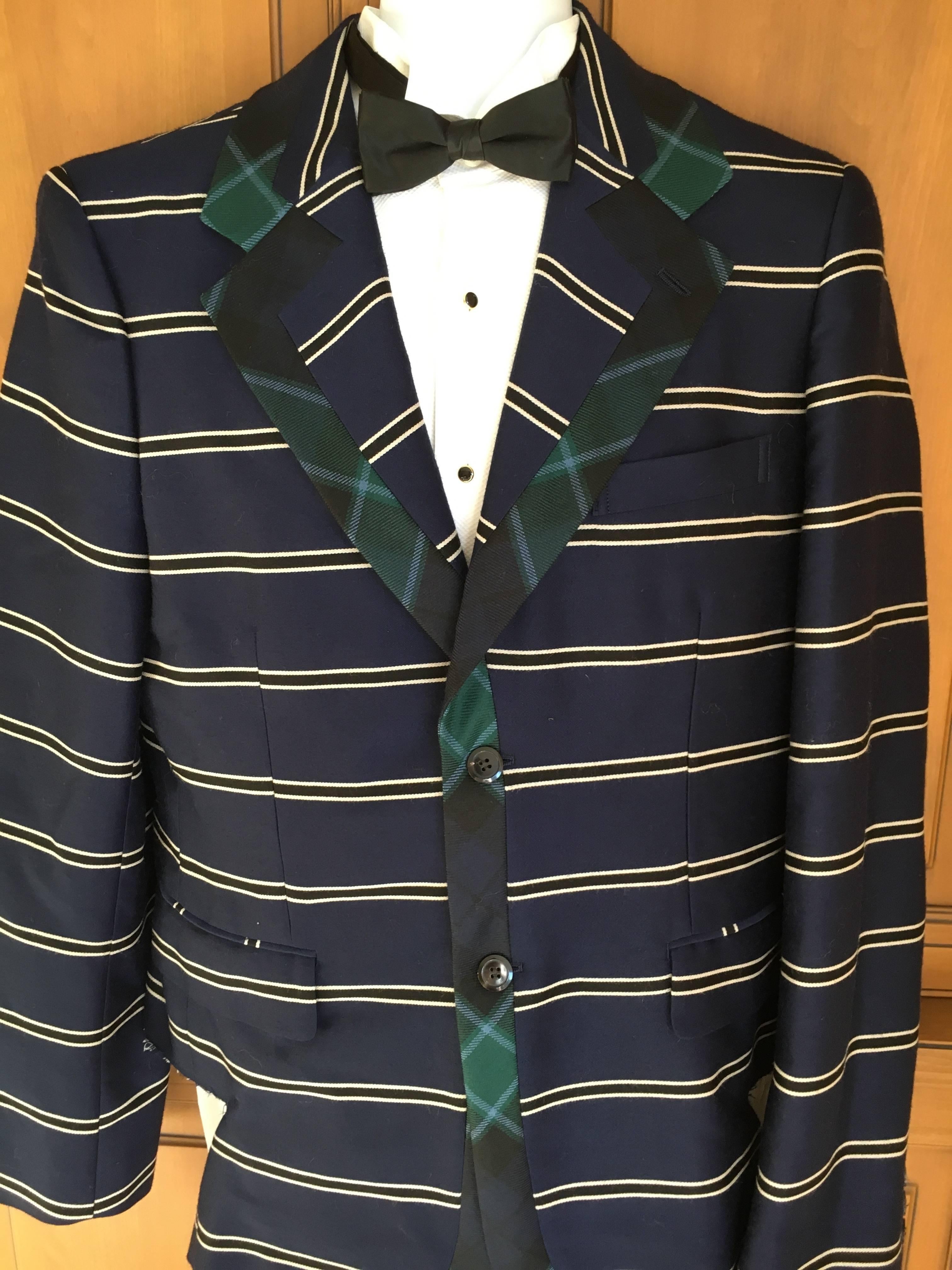 Charming stripe blazer with tartan trim from Comme des Garcons Homme Plus.
Size L
Chest 46