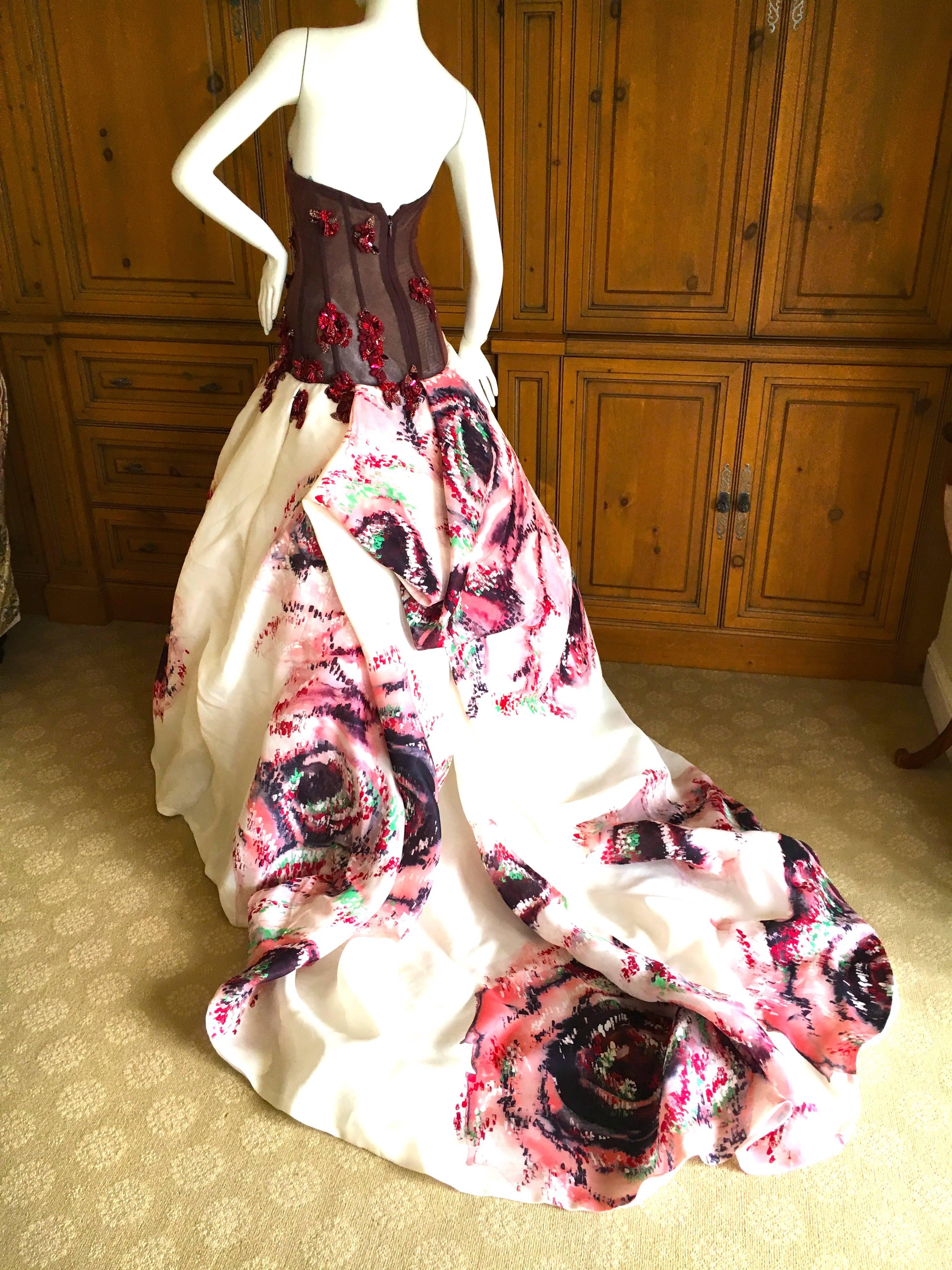 Extraordinary ball gown from Monique Lhuillier.
Featuring a corset embellished with beaded flowers, and a huge billowing floral skirt with a very long train.
This is such an amazing piece, custom made, worn once.
Size 2
Bust 34