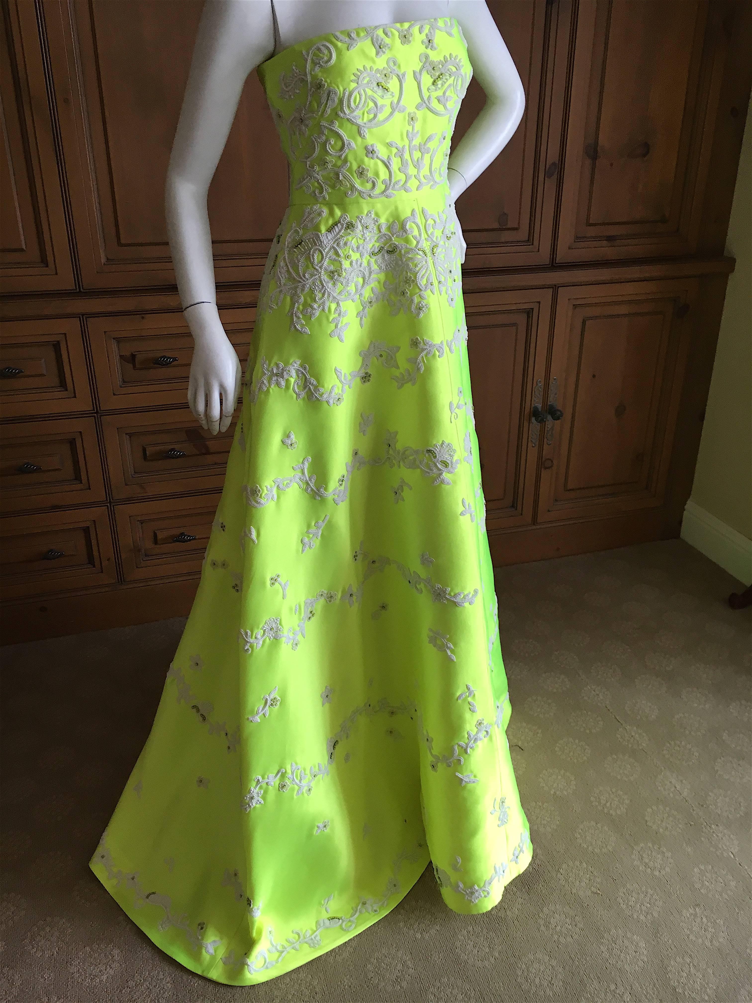 Incredible neon yellow evening dress from Valentino.
Currently on sale at $11,000 , this is unworn with tags.
The decorations are white and green Swarovski crystals in a baroque floral design.
Size 0
Bust 34