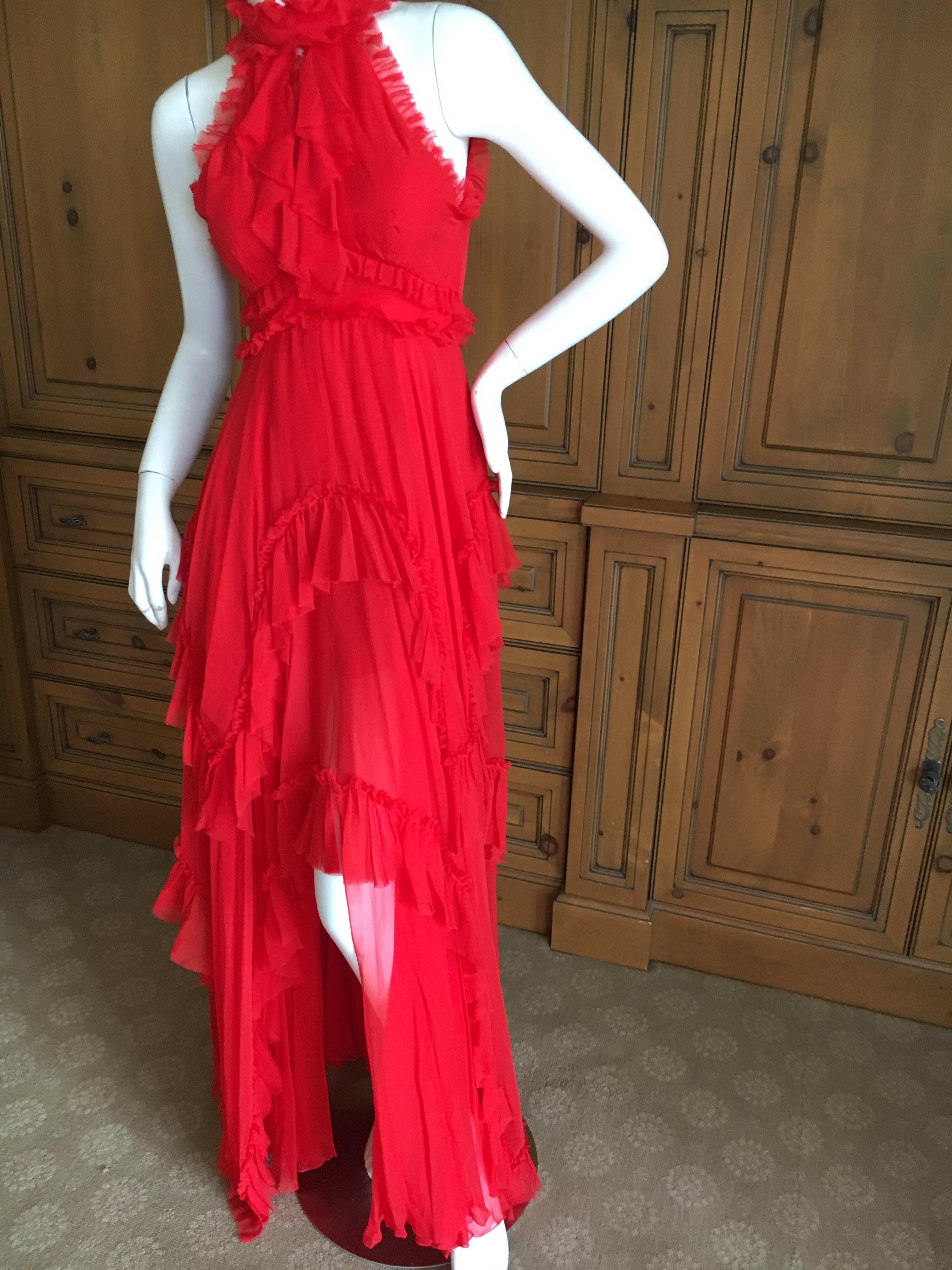 Wonderful red silk halter dress with a high low hem from Emelio Pucci.
Size 34 (4) 
Bust 34"
Waist 26"
Hips 38"
Length 61"
Excellent condition