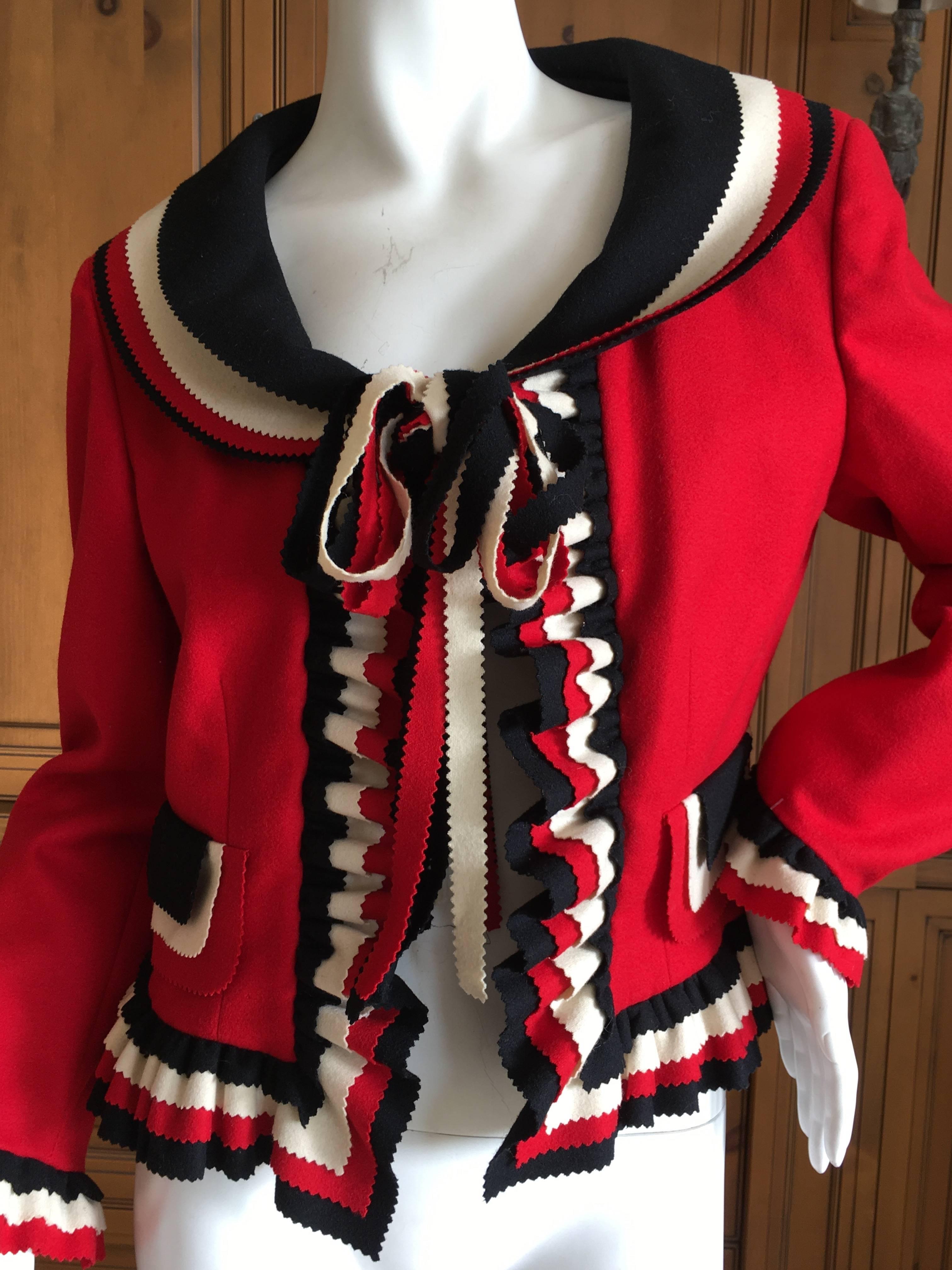 Wonderful red ruffled wool jacket from Moschino from the 1993 collecton fro Cheap and Chic.
Contrasting red, white and black with ribbon trim ties at the neck.
Underarm stains on lining
Bust 38"
Waist 32"
Length 21"
