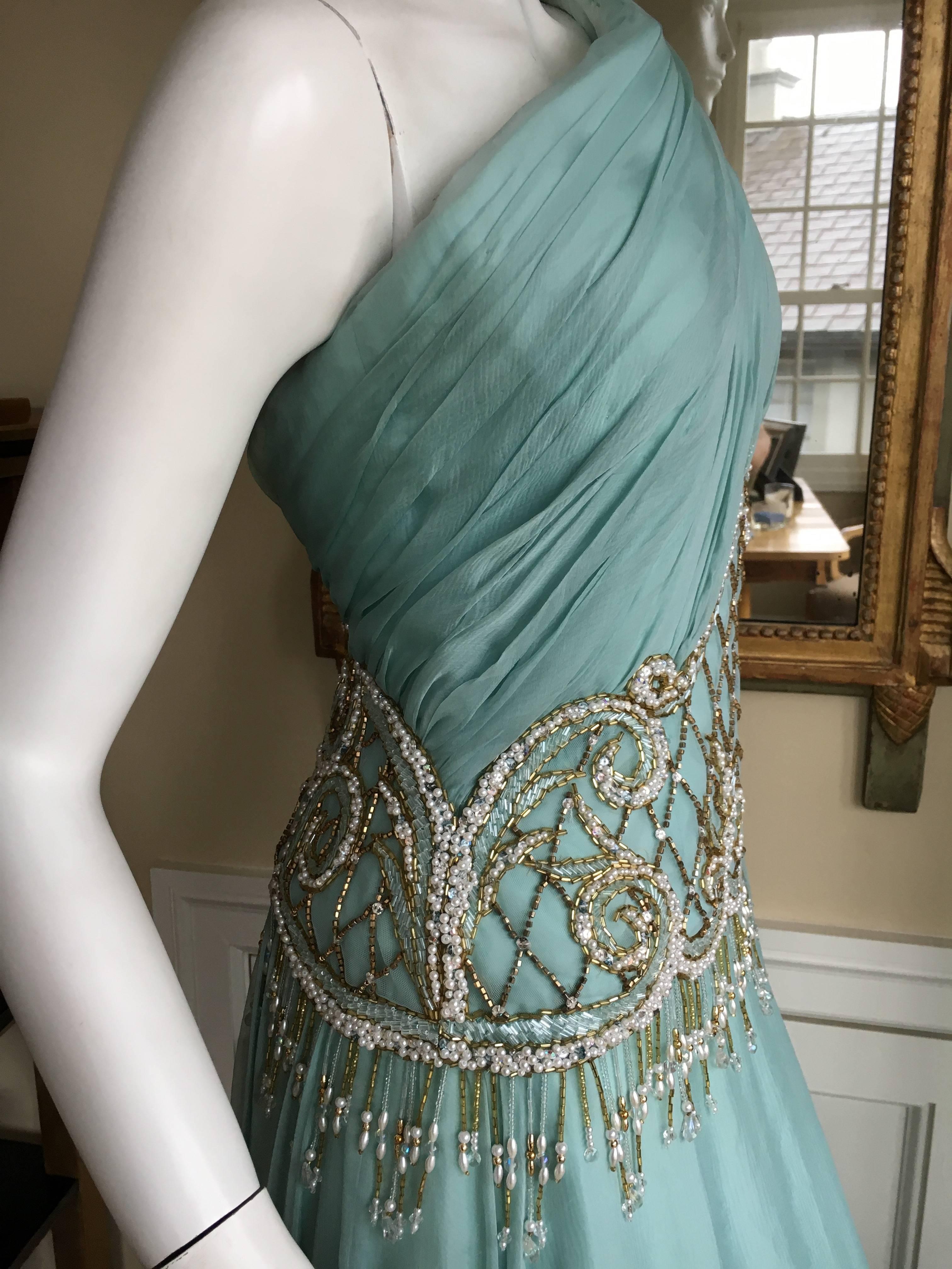 Bob Mackie One Shoulder Turquoise Goddess Gown with Fringe Pearl Embellishment.
Bust 36"
Waist 28"
HIps 45"
Length 55"