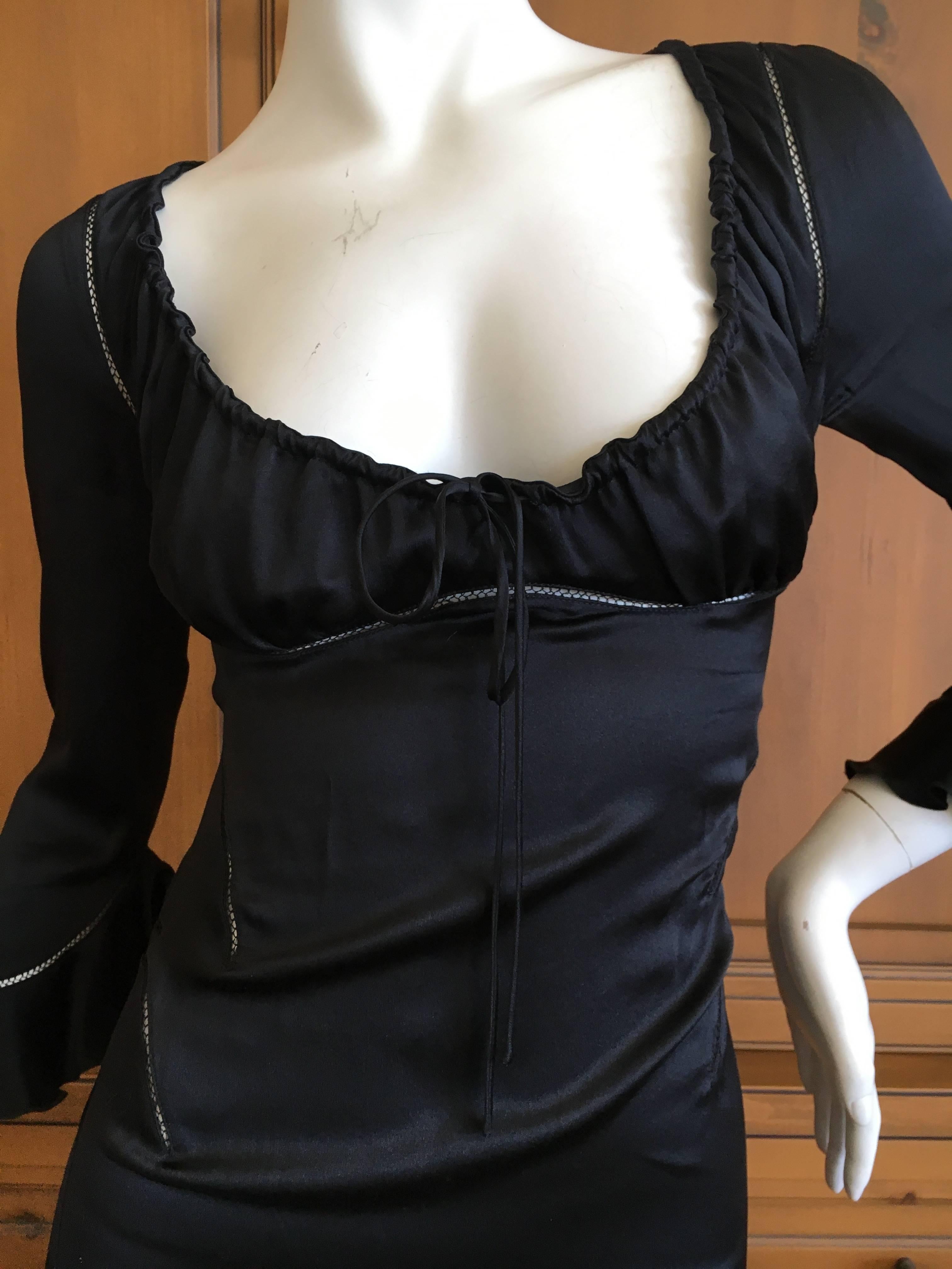Alexander McQueen Fall 2002 Supercalifrgilistic Collection Little Black Dress.
Silk with sheer cut outs.
Size 40
Bust 39"
Waist 28"
Hips 38"
Length 42"
Excellent conditon