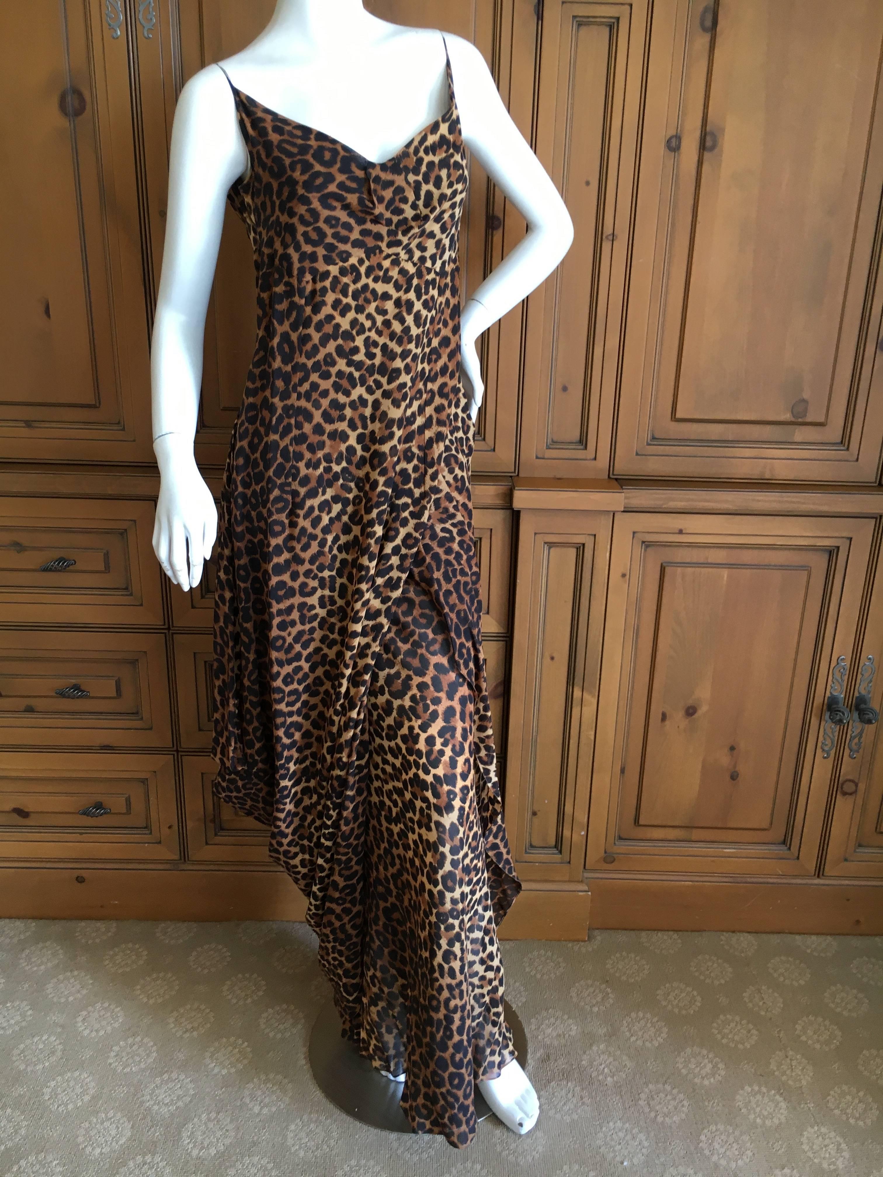 Very early label John Galliano for Bergdorf Goodman leopard print draped dress.
This is so pretty , the photos don't quite capture it. 
There is an underskirt that is exposed by the drape of the dress.
 There is an extra piece of fabric, I wrapped