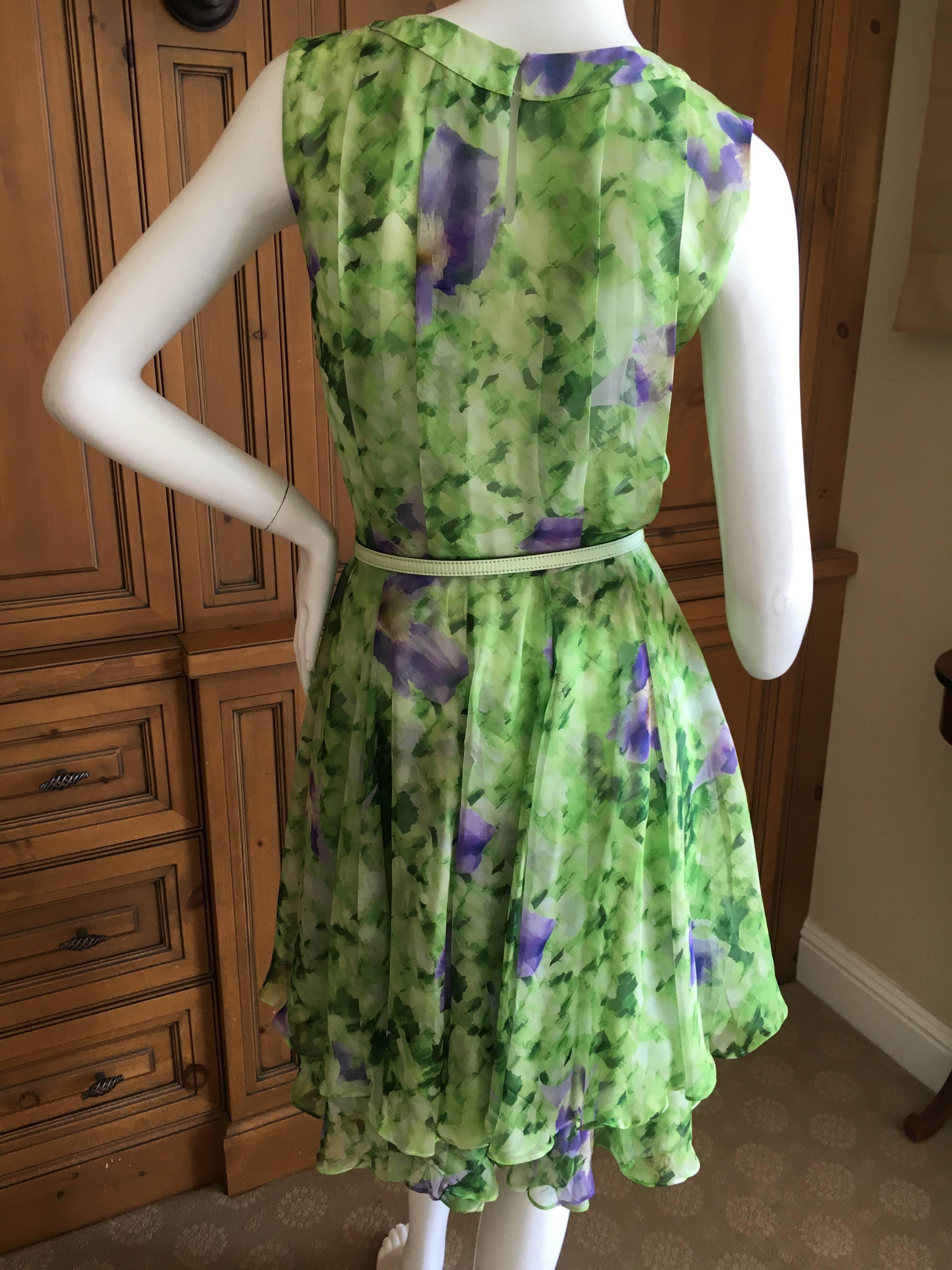 Oscar de la Renta Silk Floral Dress with Belt and Sweater.
Size 0
Sleeveless silk floral dress with matching leather lined belt, and knit short cardigan bolero.
Bust 36"
Waist 25"
Hips 42"
Length 40"
Excellent condition